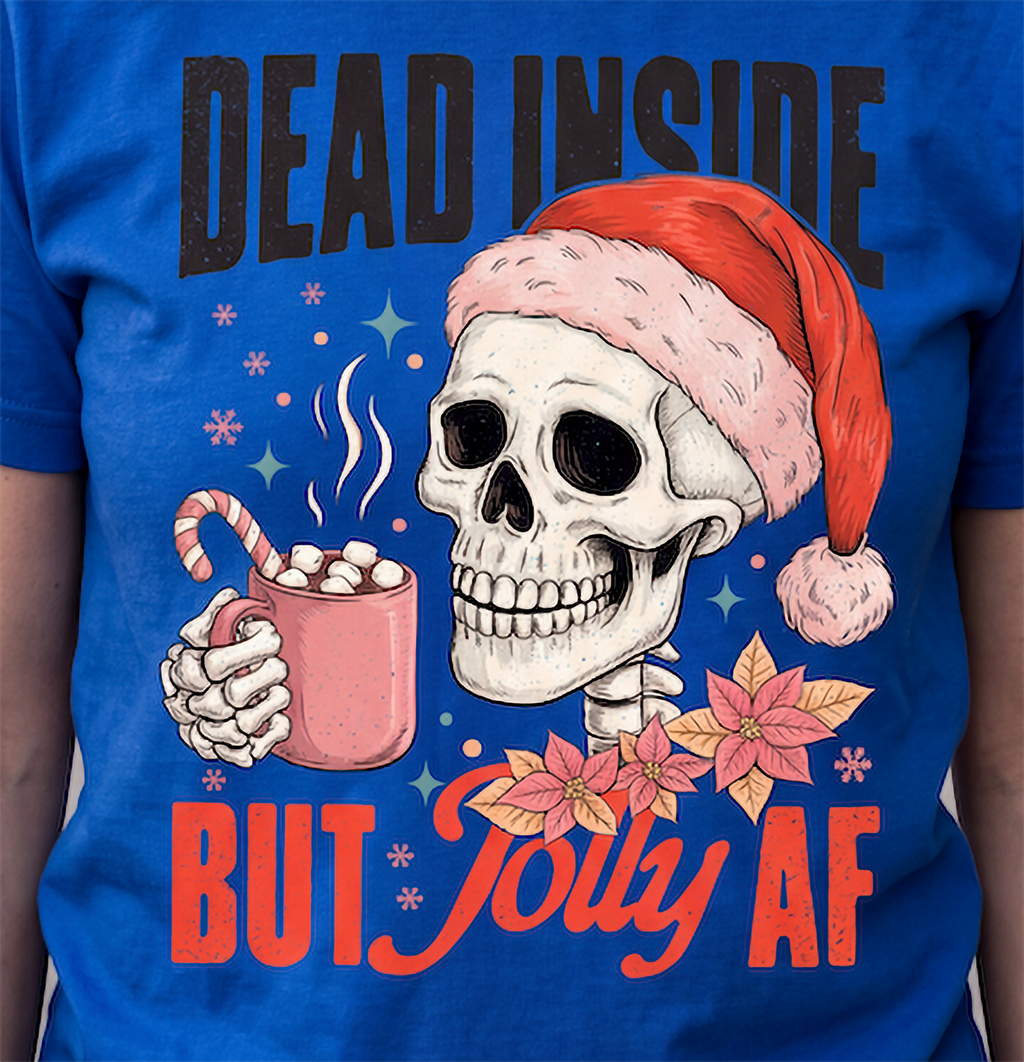 Close-up of Dead Inside But Jolly AF skeleton Christmas graphic printed on blue shirt.