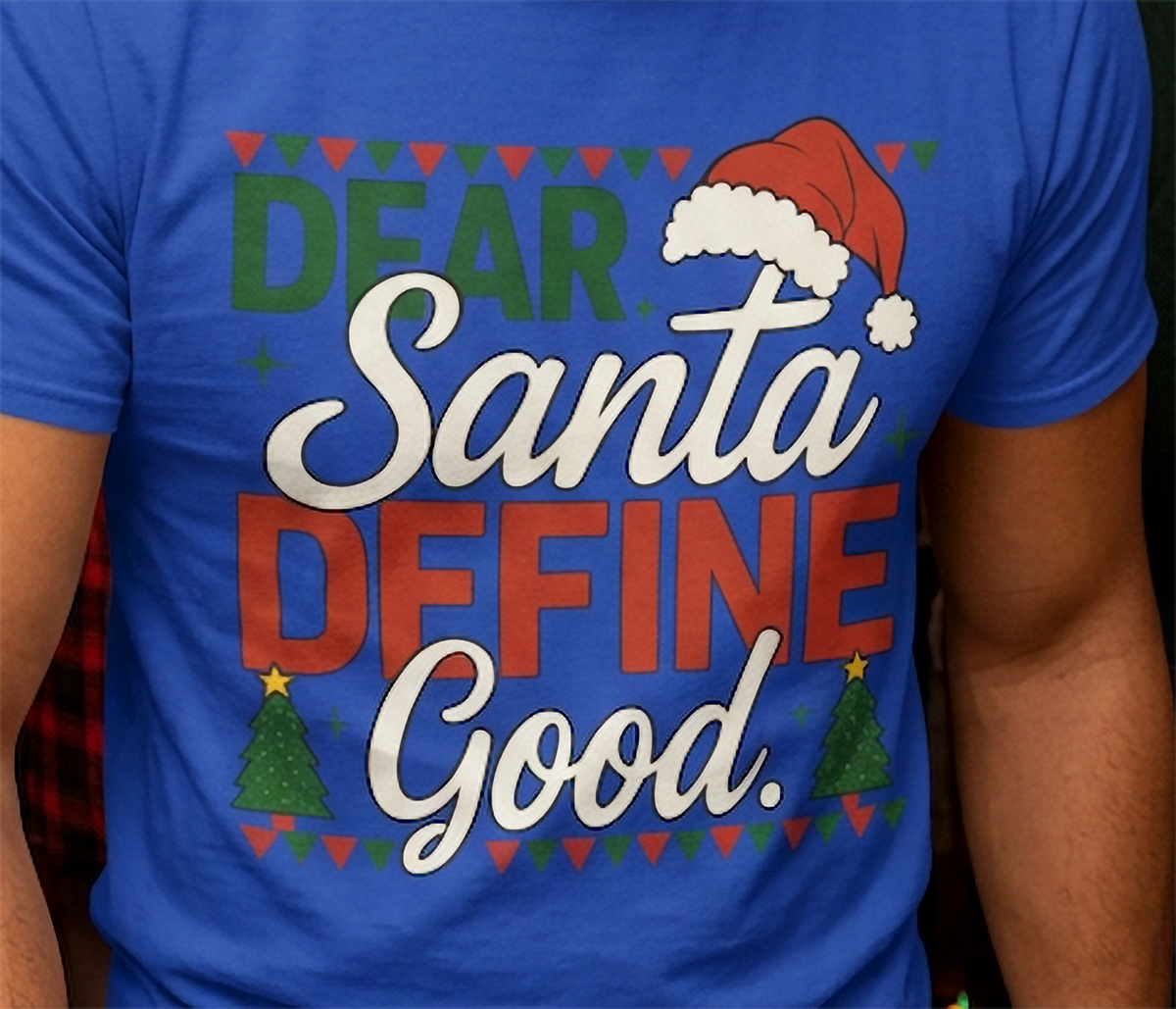 Blue Close-Up: Detailed view of the Dear Santa Define Good Christmas graphic printed on a blue unisex holiday t-shirt.