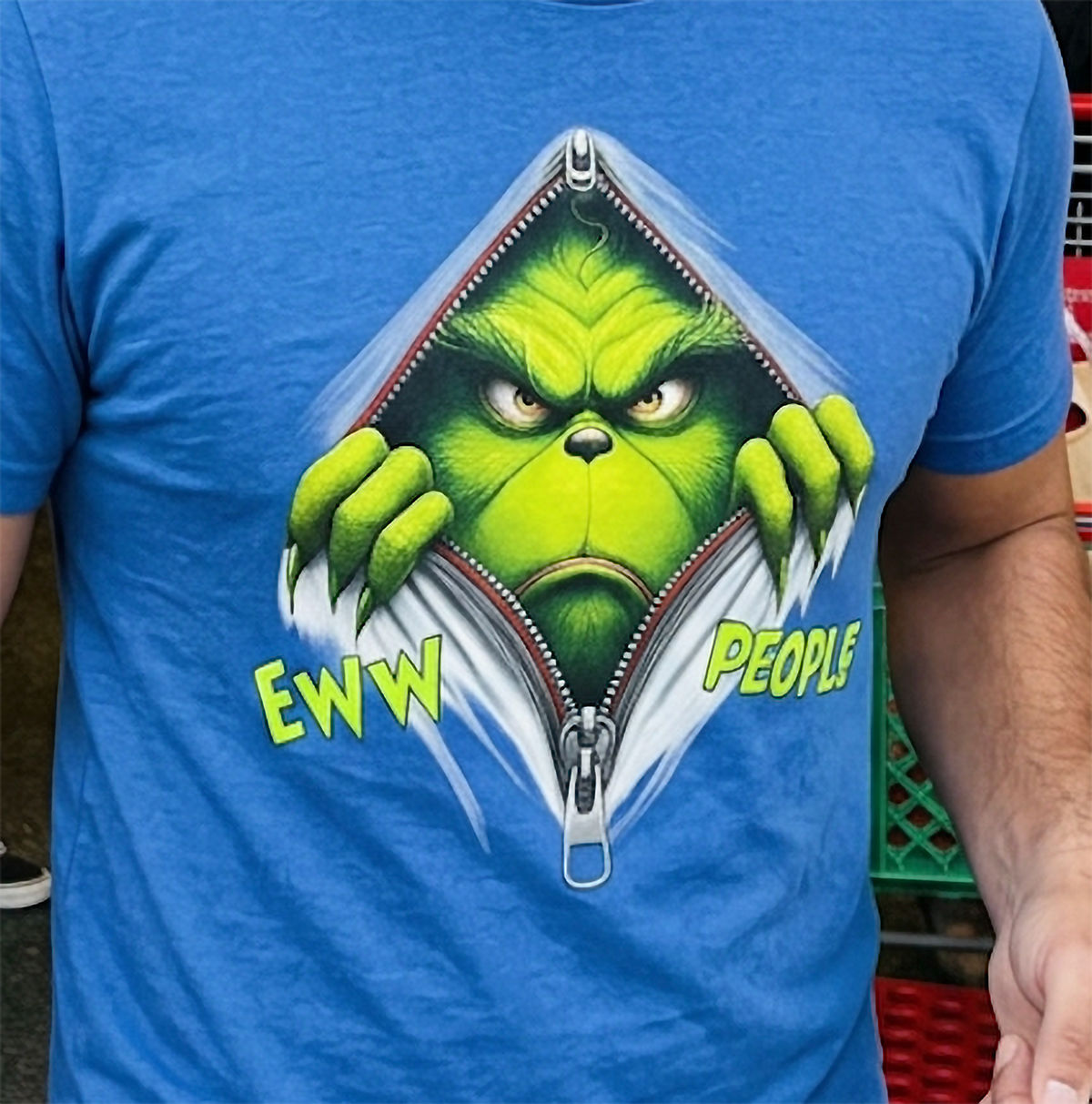 Blue Close-Up: Detailed close-up of the Eww People Grinch Christmas graphic on a blue shirt showing the vibrant green artwork.