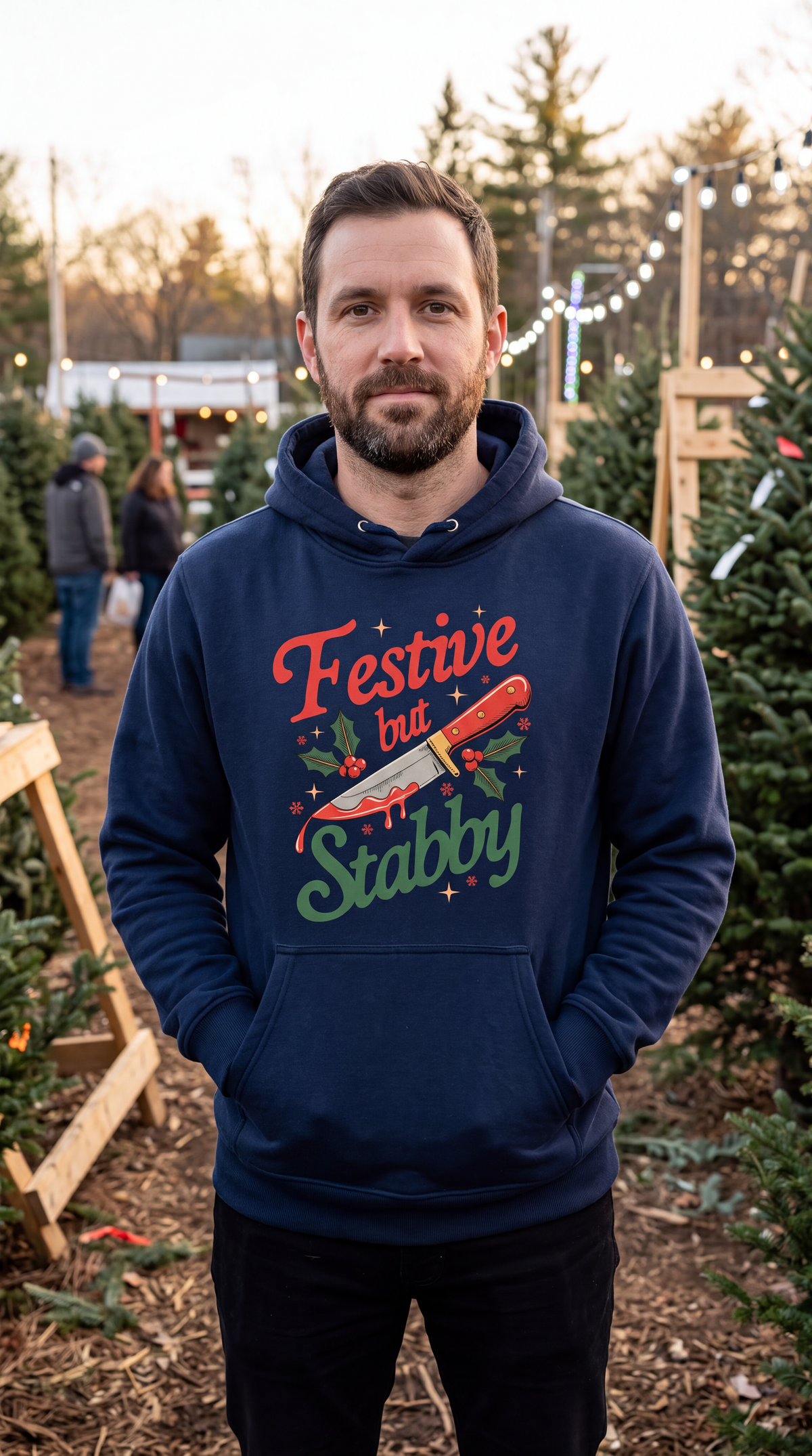 Man wearing navy blue Festive But Stabby funny Christmas hoodie