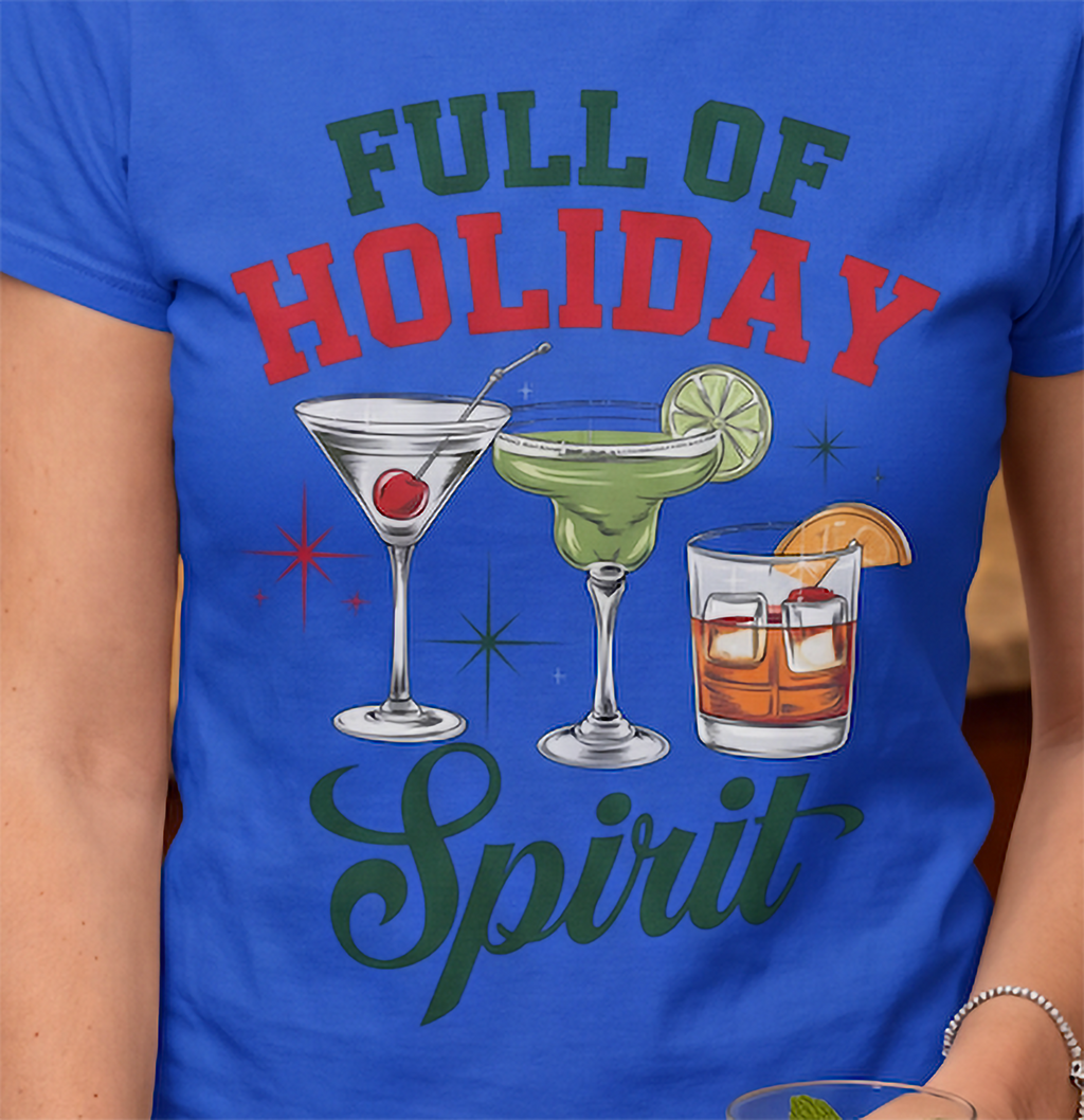 Close-up of Full of Holiday Spirit Christmas cocktail design on blue shirt.