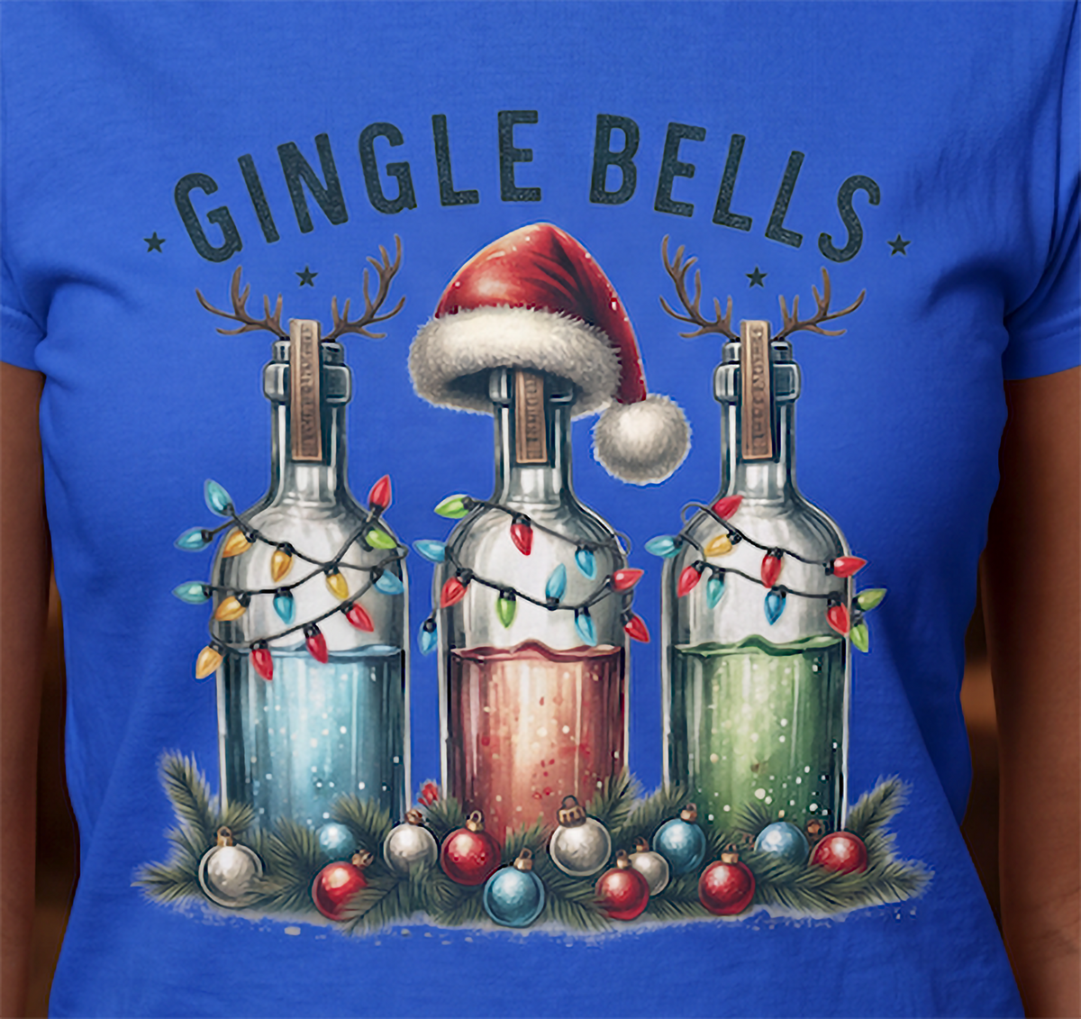 Close-up of Gingle Bells Christmas graphic with festive liquor bottles on blue shirt