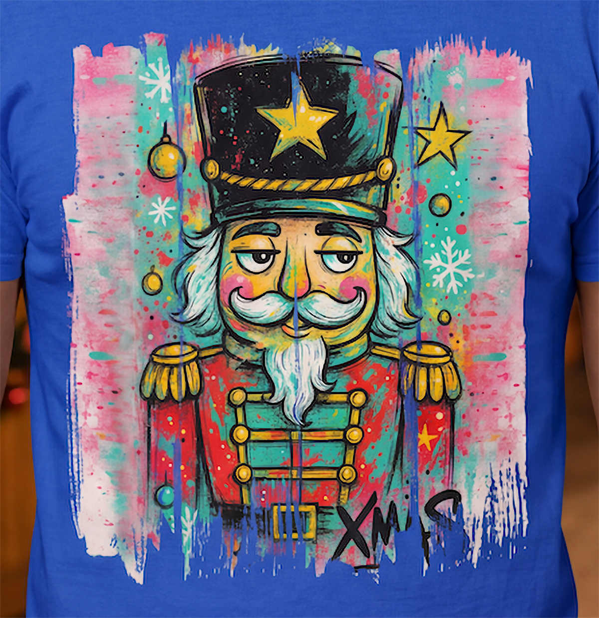 Close-up of colorful graffiti nutcracker Christmas artwork on blue shirt