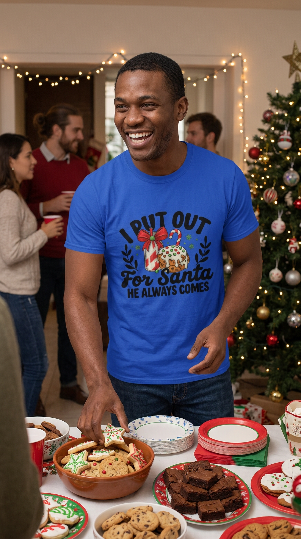 Man wearing blue I Put Out for Santa funny adult Christmas shirt at a holiday gathering