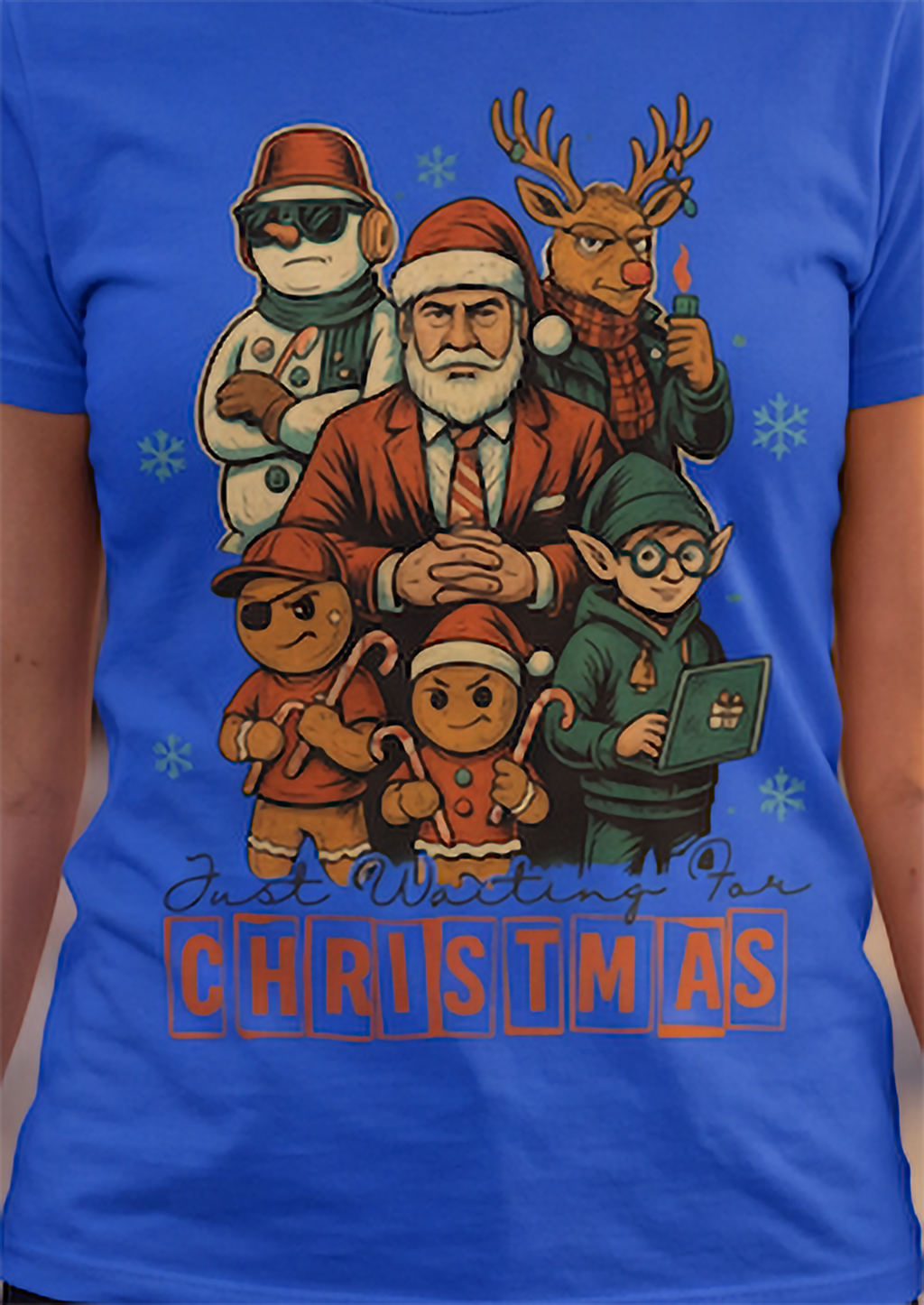 Close-up of royal blue funny Christmas shirt featuring Santa, reindeer, elf, snowman and gingerbread artwork.
