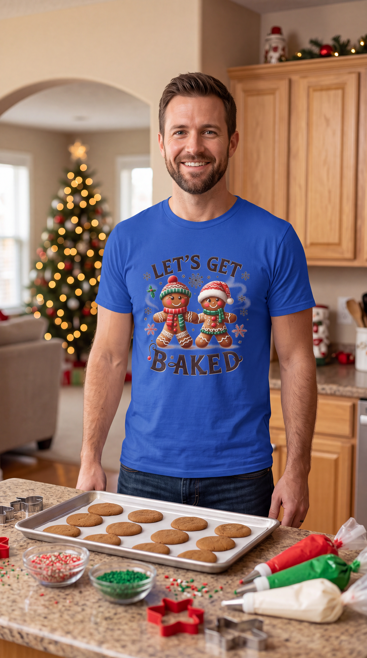 Woman wearing blue Let’s Get Baked Christmas graphic T-shirt in a festive holiday setting