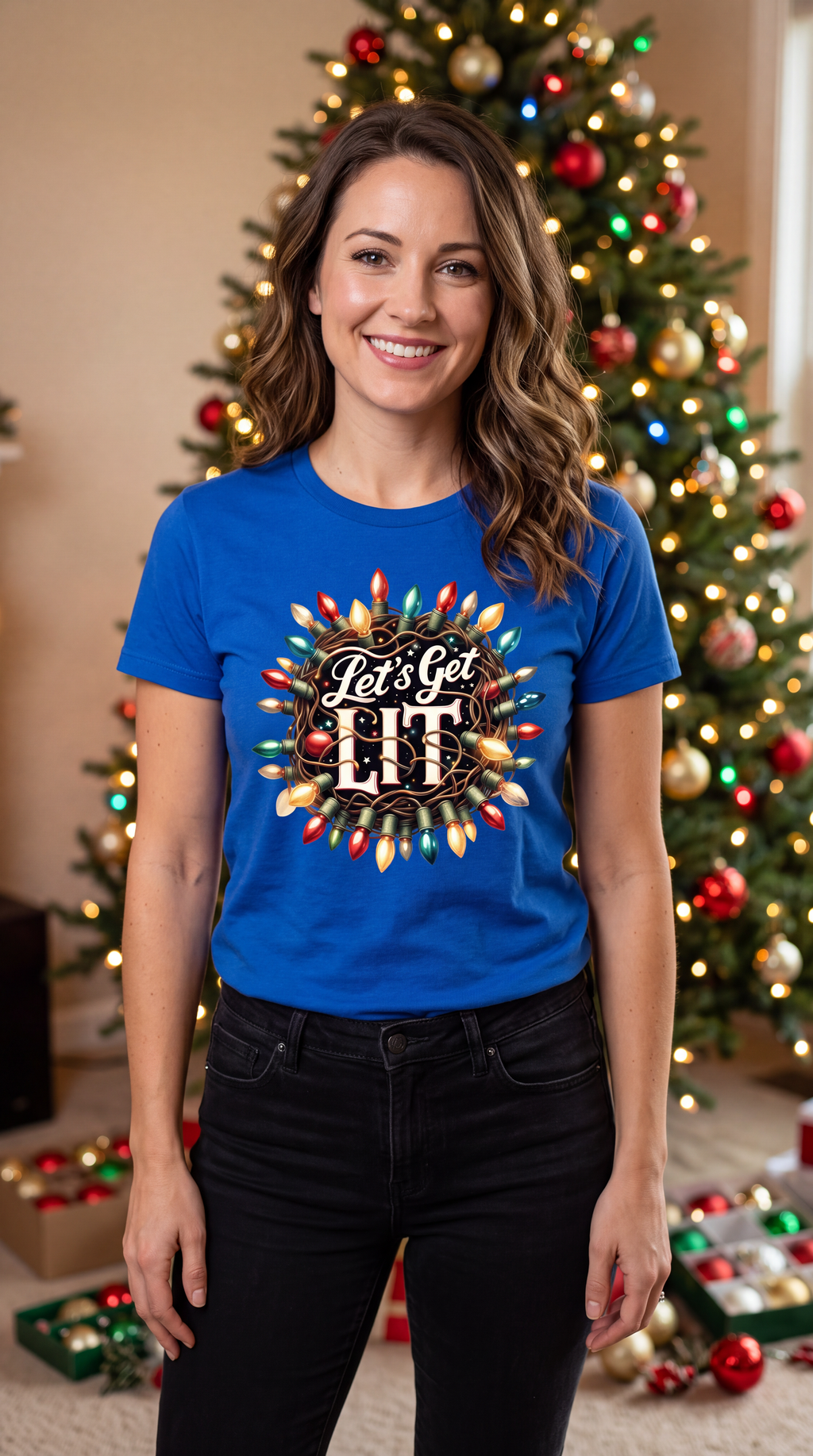 Woman wearing blue Let’s Get Lit Christmas graphic T-shirt in a festive holiday setting