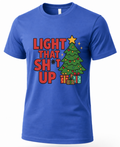 Royal blue Light That Shit Up Christmas shirt featuring a decorated tree, presents and bold holiday lettering.