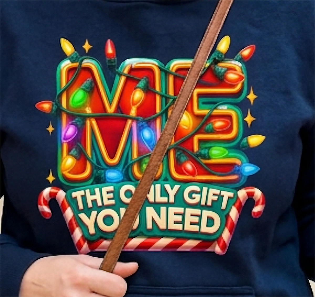 Close-up of Me The Only Gift You Need graphic on navy blue Christmas hoodie