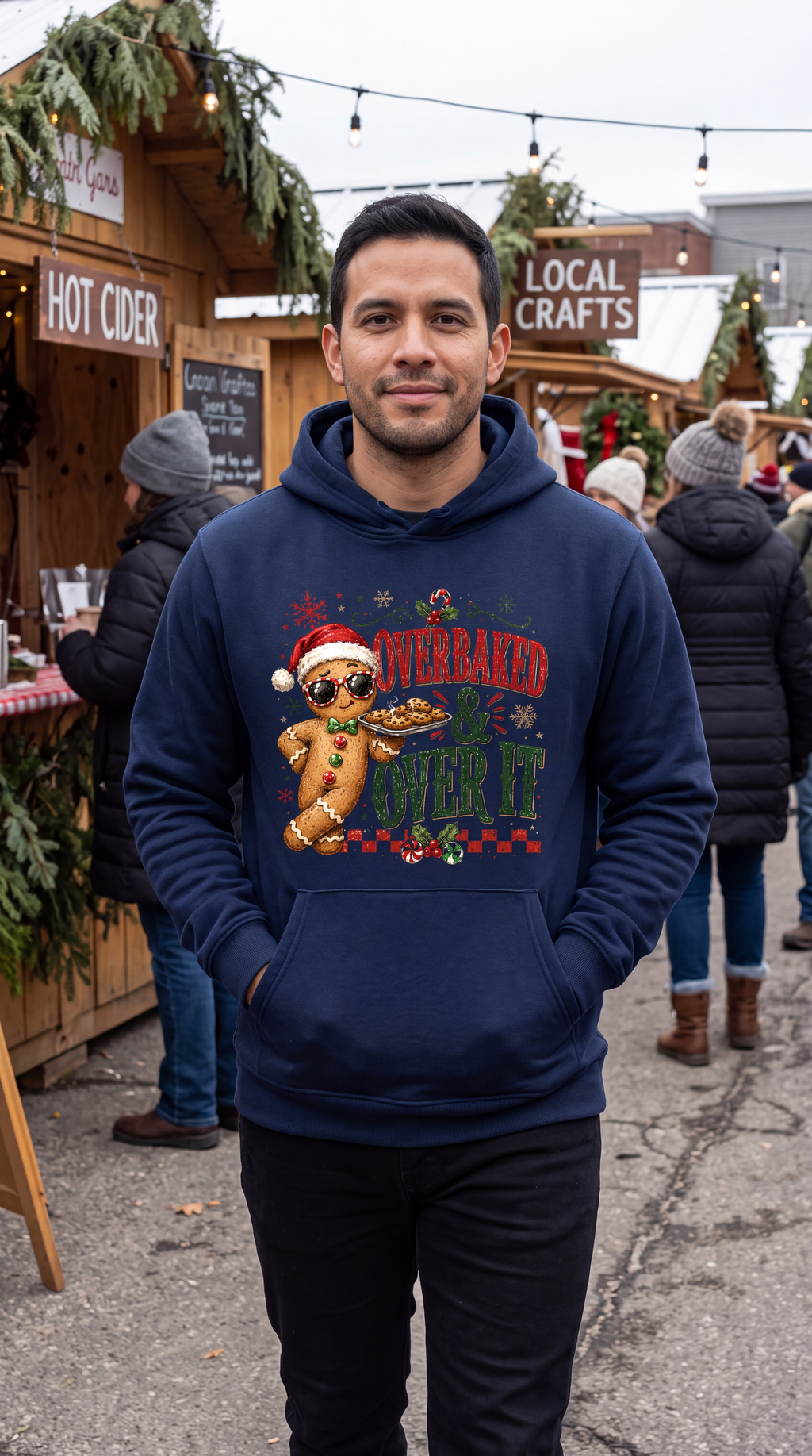 Man wearing navy blue gingerbread Christmas hoodie with funny holiday design