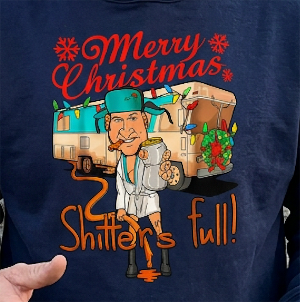 Close-up of Shitter’s Full Cousin Eddie graphic on navy blue Christmas hoodie