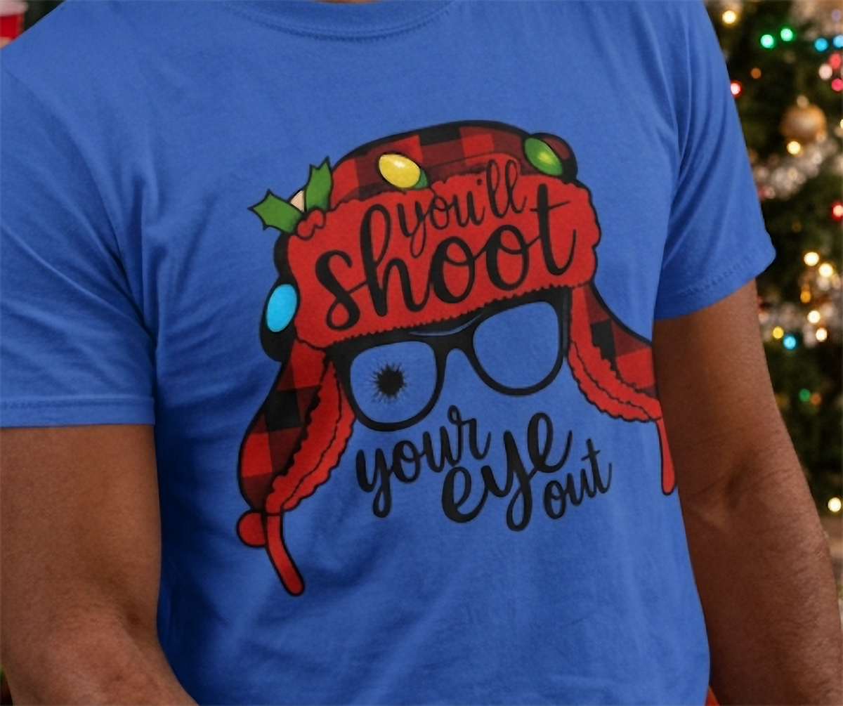 Close-up of blue Christmas movie quote graphic tee featuring red plaid winter hat and white sunglasses