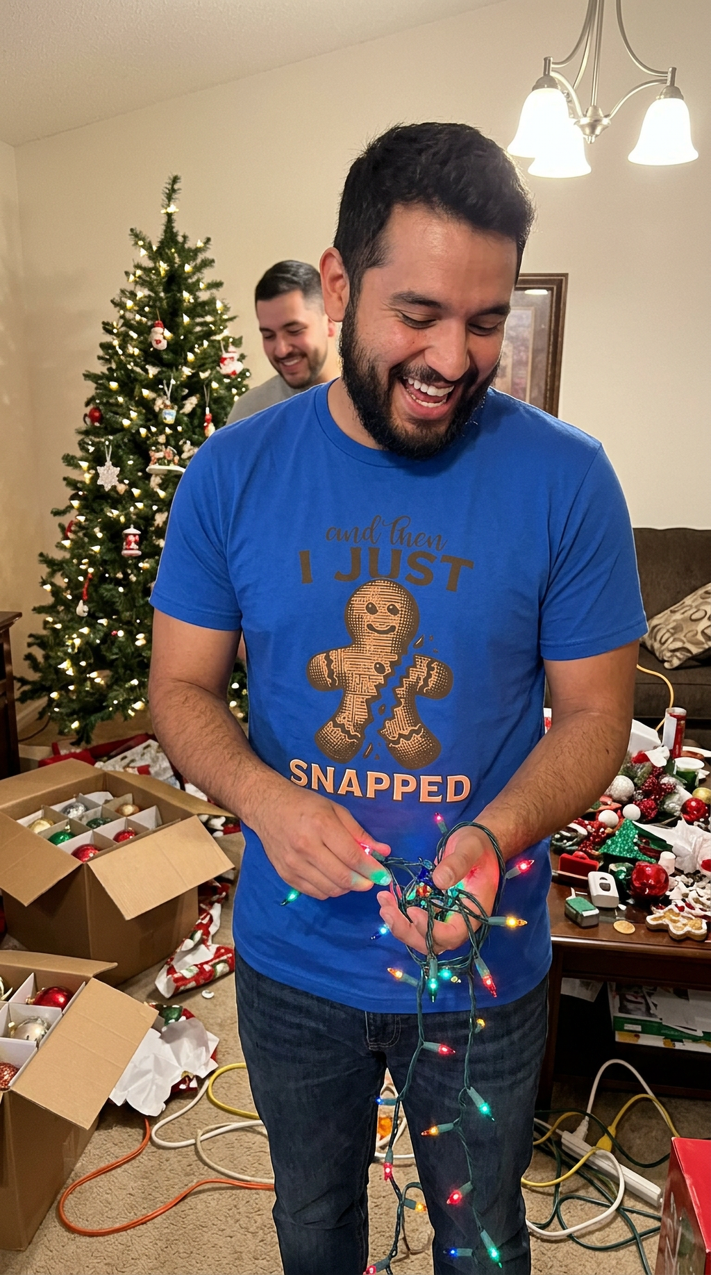 Blue Lifestyle: Man wearing a blue funny gingerbread Christmas graphic t-shirt while preparing holiday baked goods.