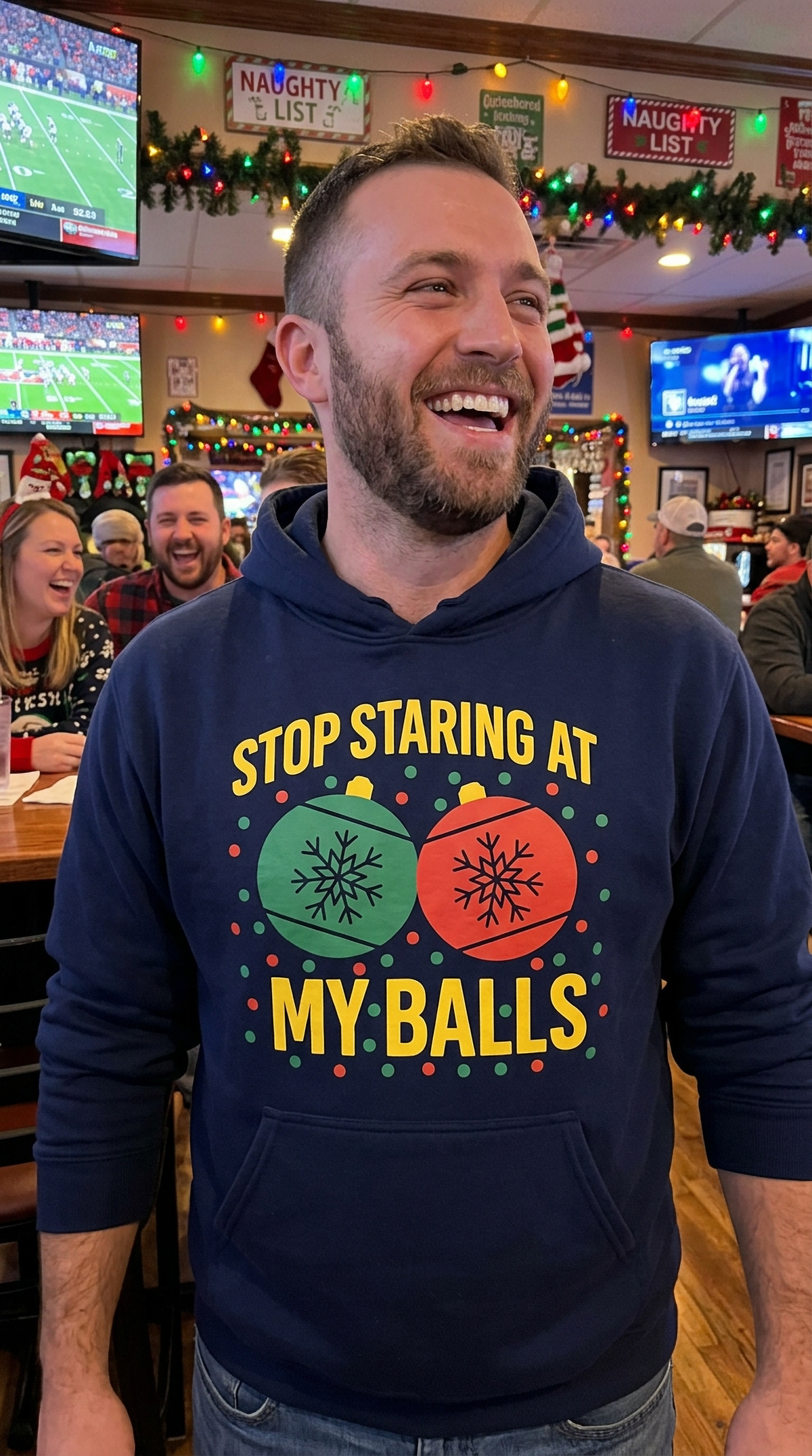 Man wearing navy blue Stop Staring at My Balls funny Christmas hoodie at a holiday party