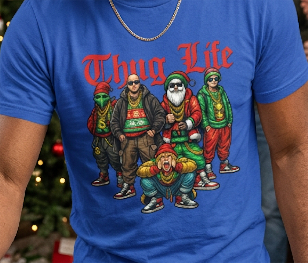 Close-up of blue Christmas graphic tee featuring Thug Life lettering and detailed festive streetwear characters