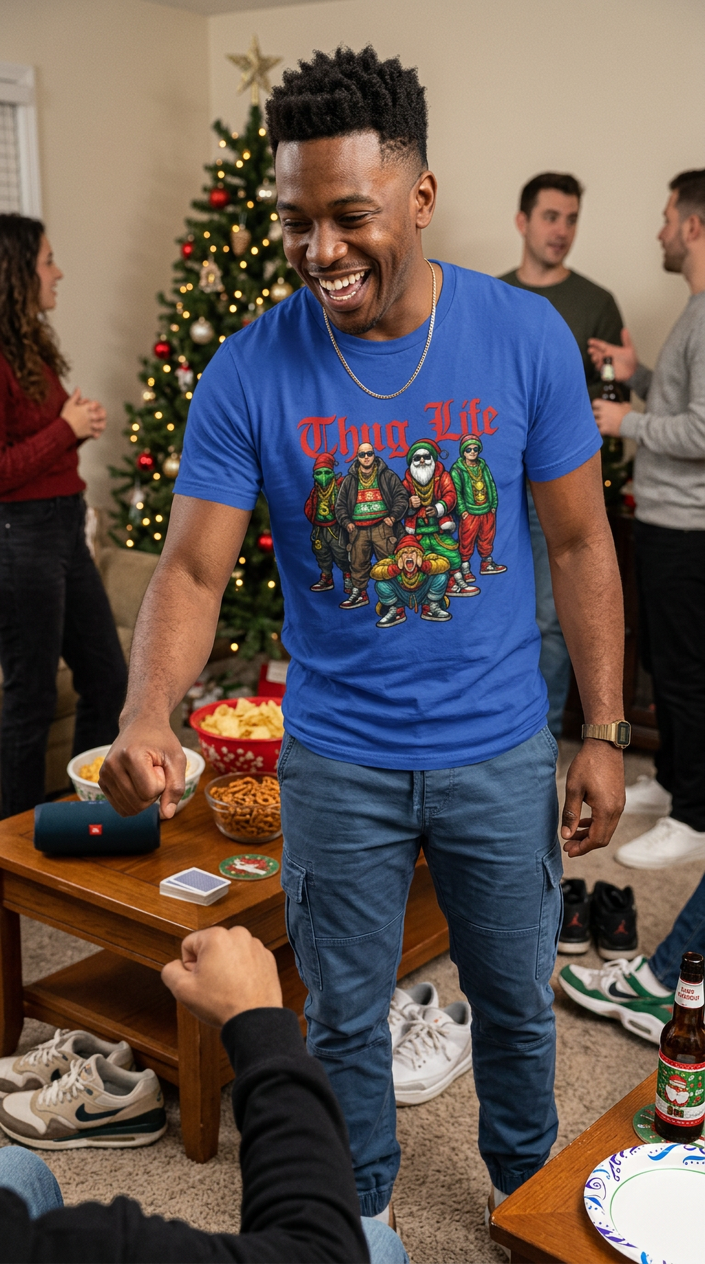 Man wearing blue Thug Life Christmas graphic t-shirt at a casual indoor holiday gathering