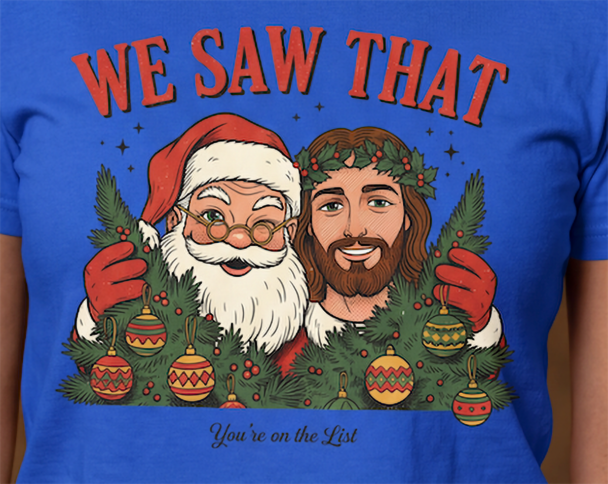 Close-up of We Saw That Santa and Jesus Christmas artwork on blue shirt