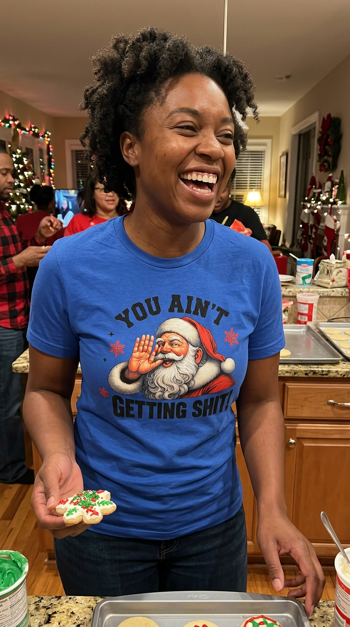 Blue Lifestyle: Woman wearing a blue funny Christmas graphic t-shirt featuring a vintage Santa Claus design at a holiday celebration.