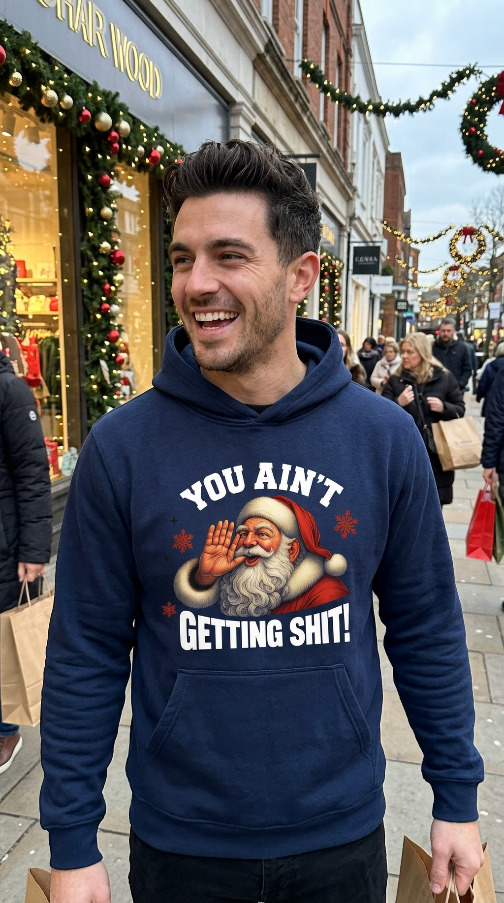 Man wearing navy blue You Ain’t Getting Shit Santa hoodie at a holiday gathering