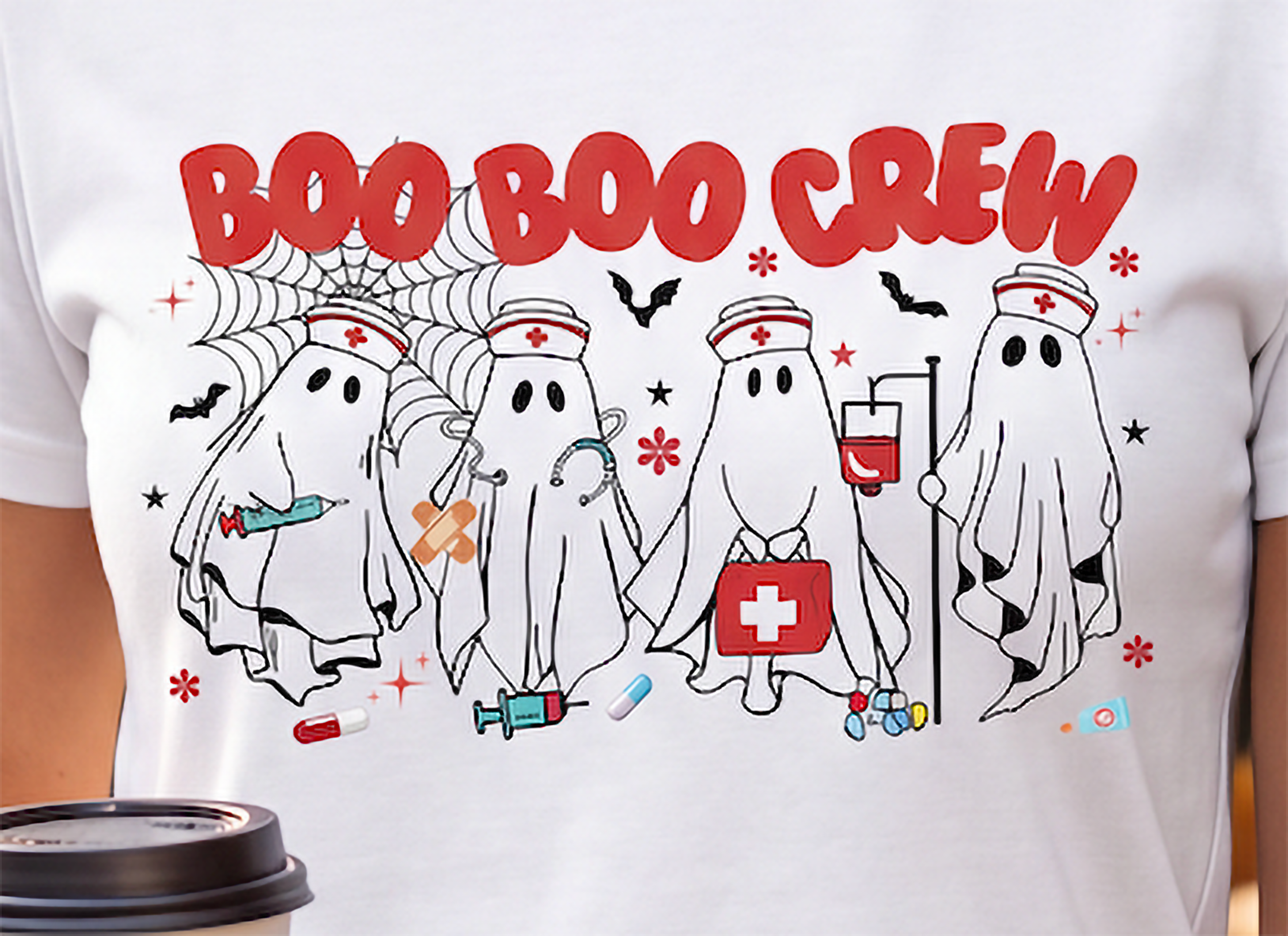 Close-up of Boo Boo Crew Halloween nurse design with four ghost nurses, medical accessories, bats and spiderweb details.