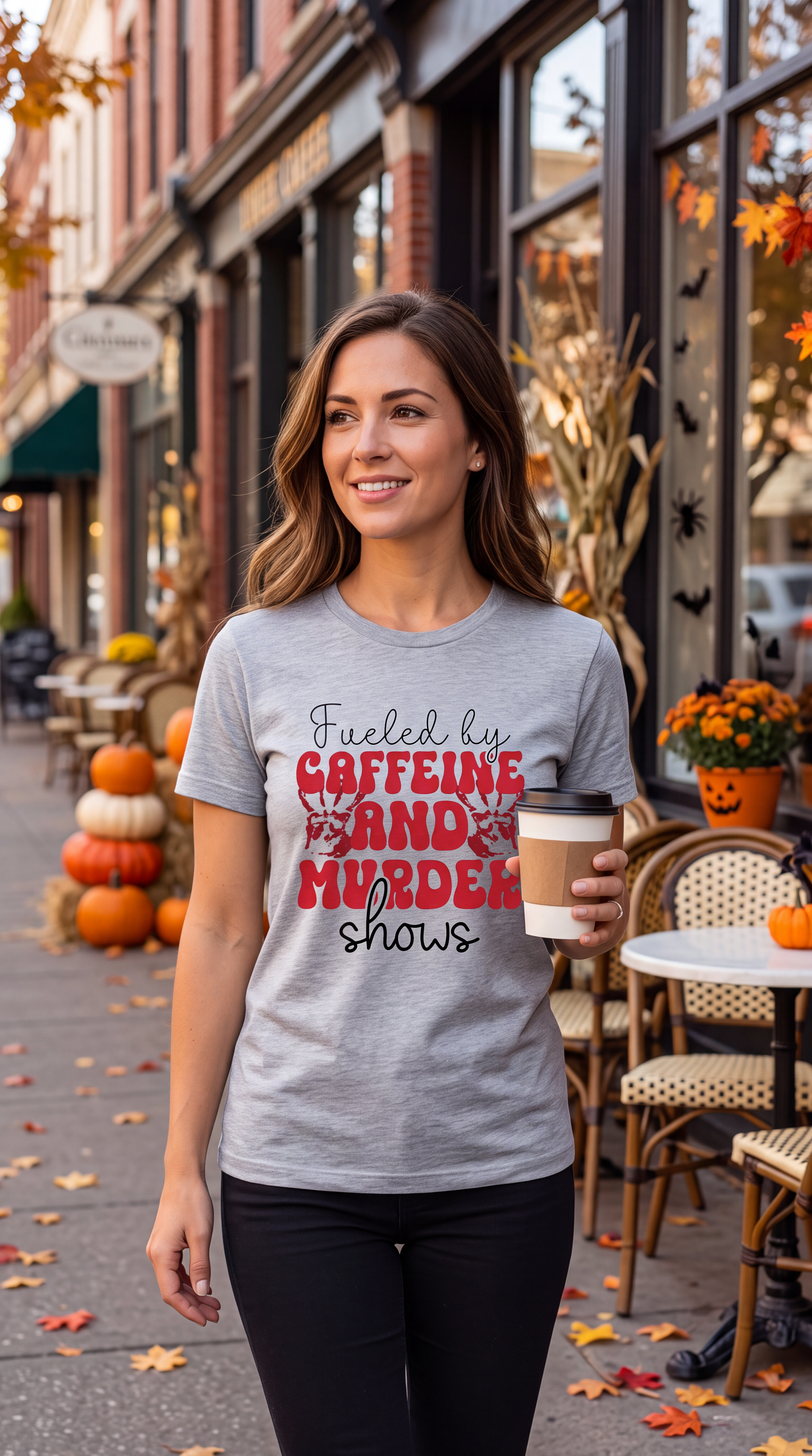 Woman wearing Heather Gray true crime coffee shirt with Caffeine and Murder Shows graphic while holding coffee outdoors