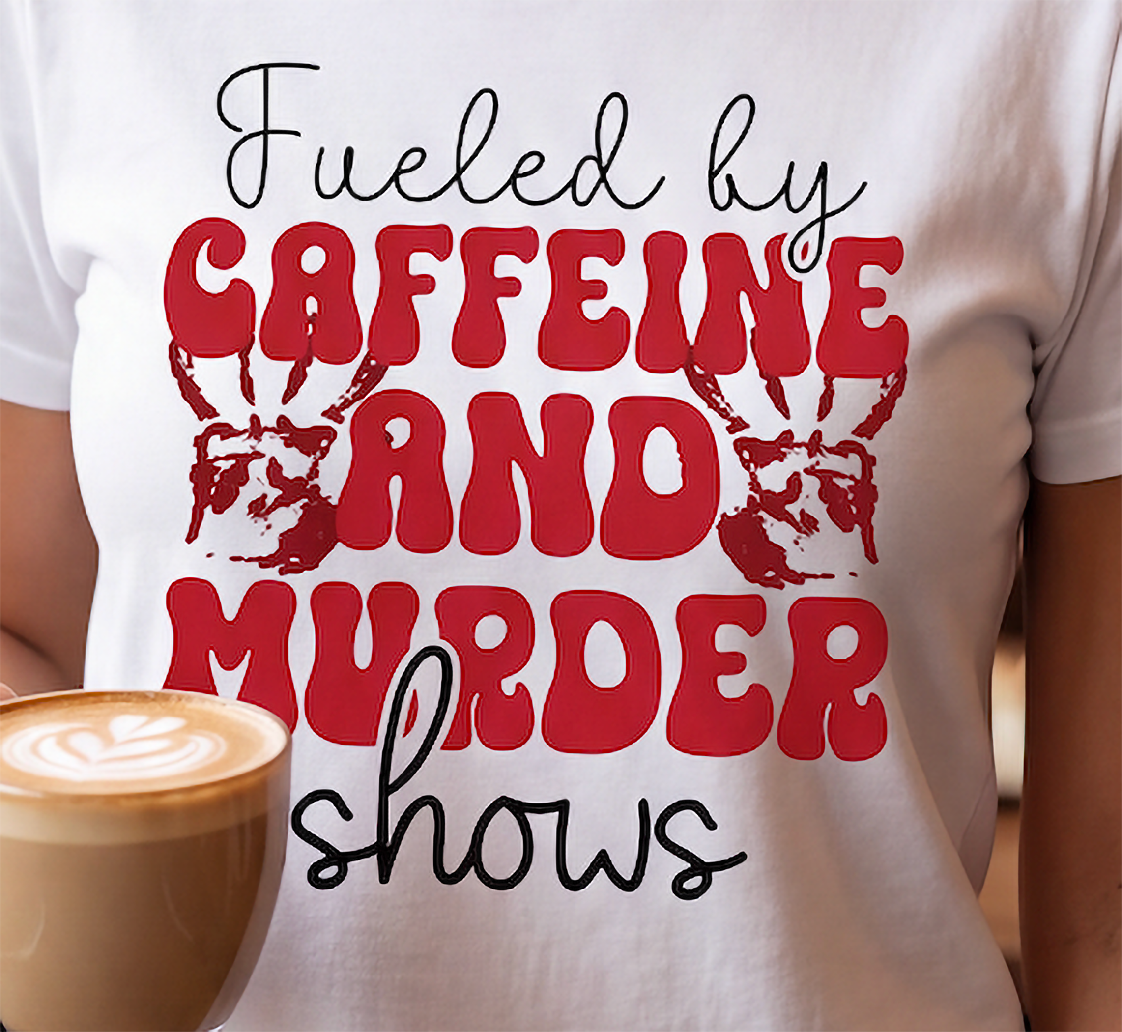 Close-up of Fueled by Caffeine and Murder Shows true crime graphic with red lettering and bloody handprints on white shirt