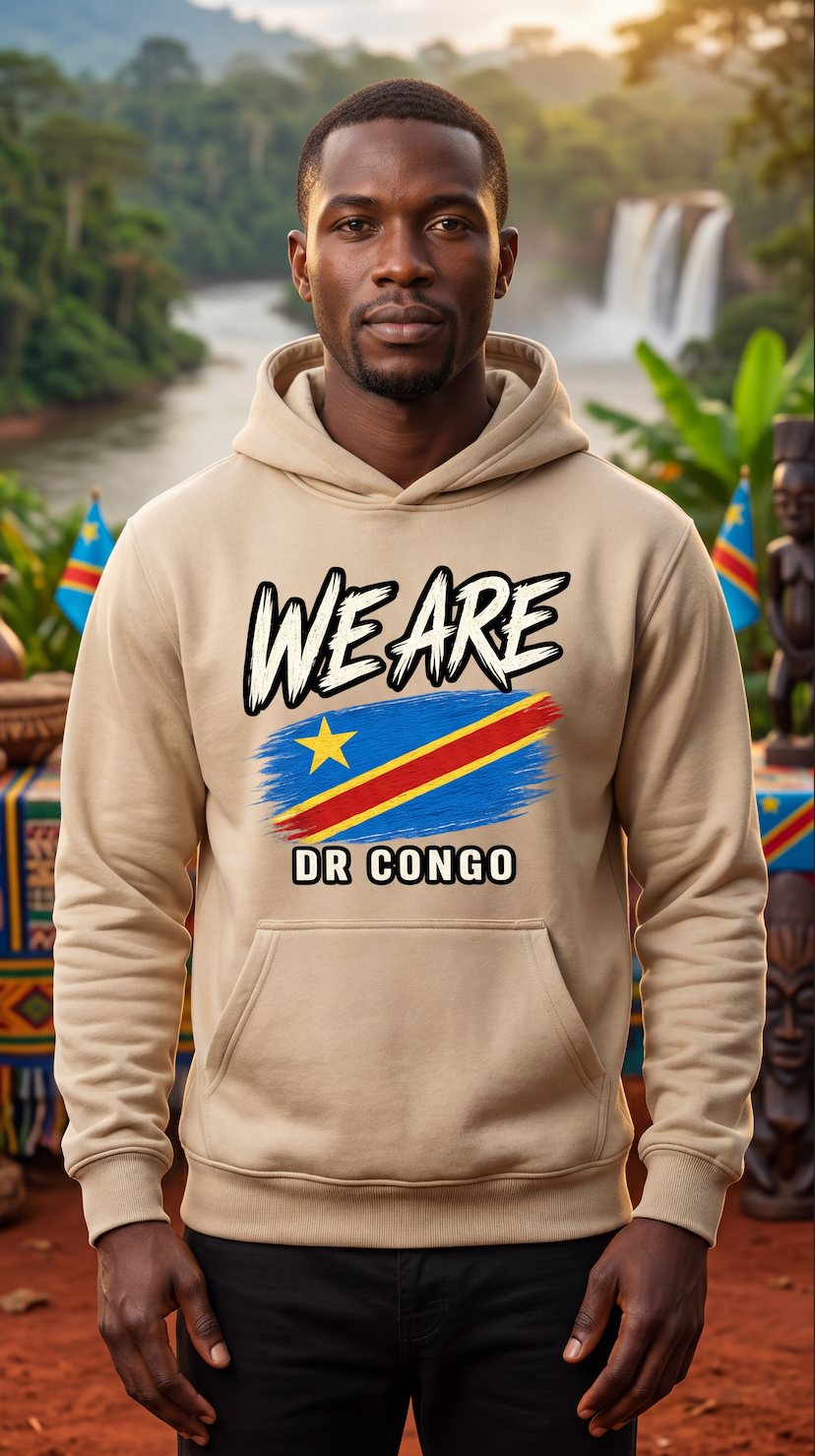 A man wearing a beige hoodie with a graphic print of the Democratic Republic of Congo flag and the text 'WE ARE DR CONGO'. The background shows a lush, tropical waterfall landscape.