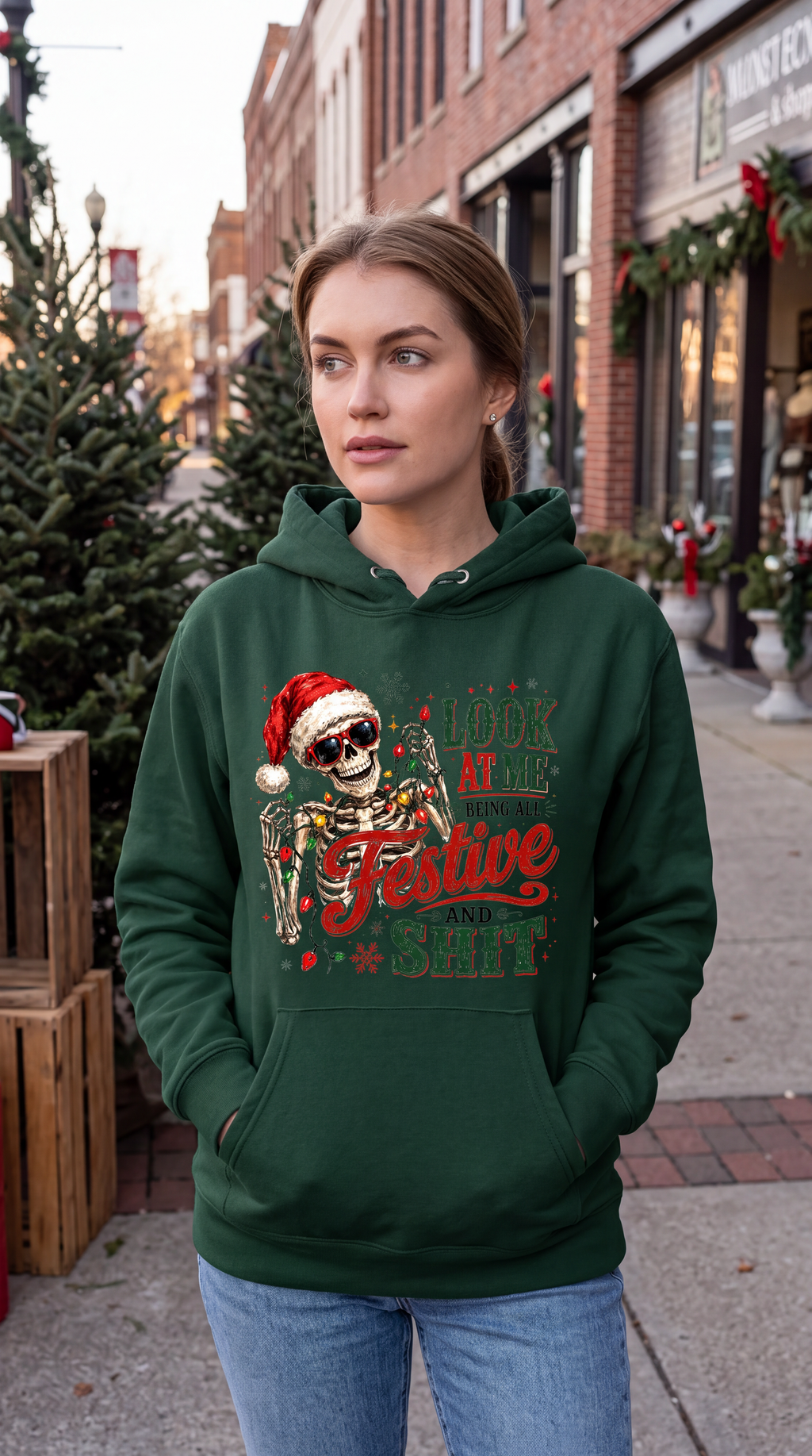 Woman wearing forest green Christmas skeleton hoodie with funny holiday design