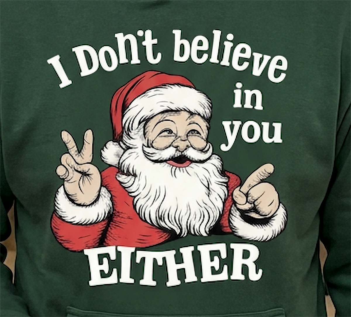 Close-up of I Don’t Believe in You Either Santa graphic on forest green Christmas hoodie