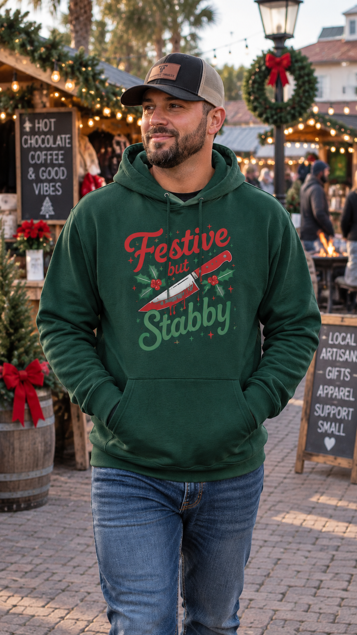 Man wearing forest green Festive But Stabby dark humor Christmas hoodie