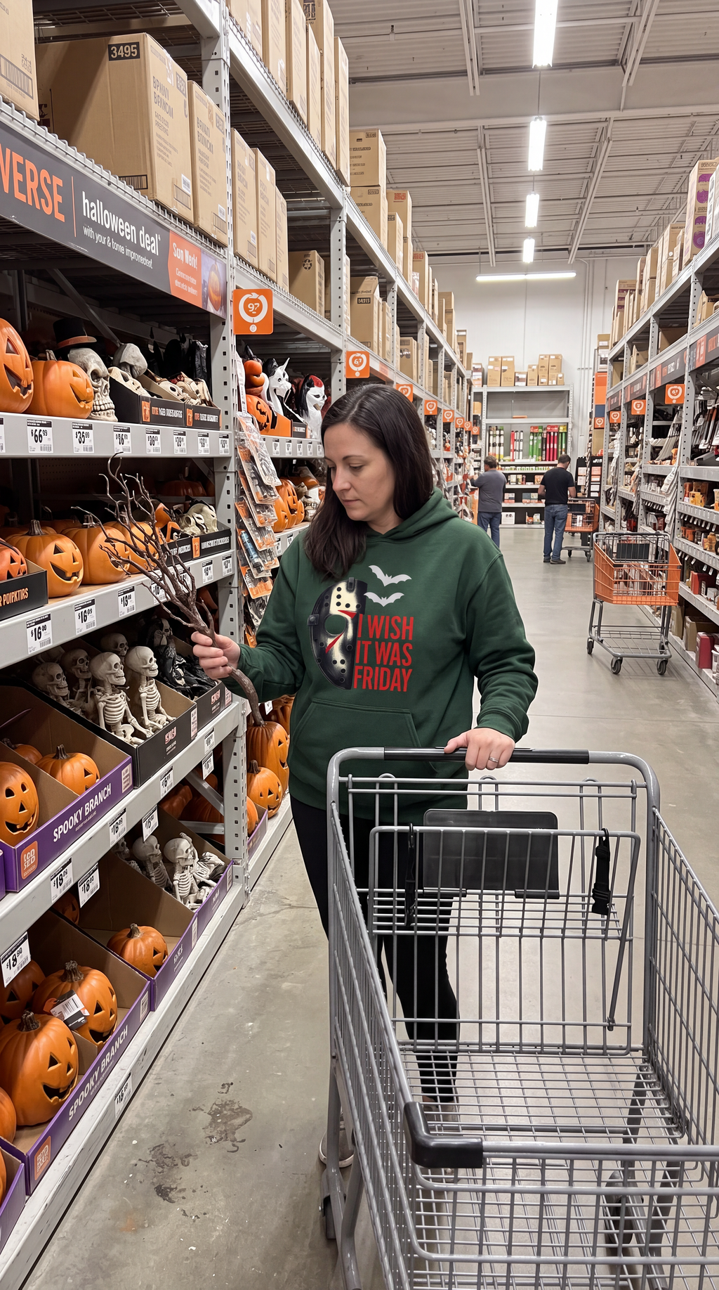 Woman wearing forest green Friday the 13th Jason Voorhees horror hoodie in store