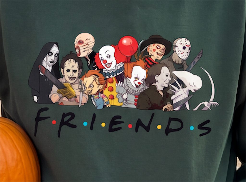 Close-up of forest green Horror Friends Halloween hoodie with classic horror icons