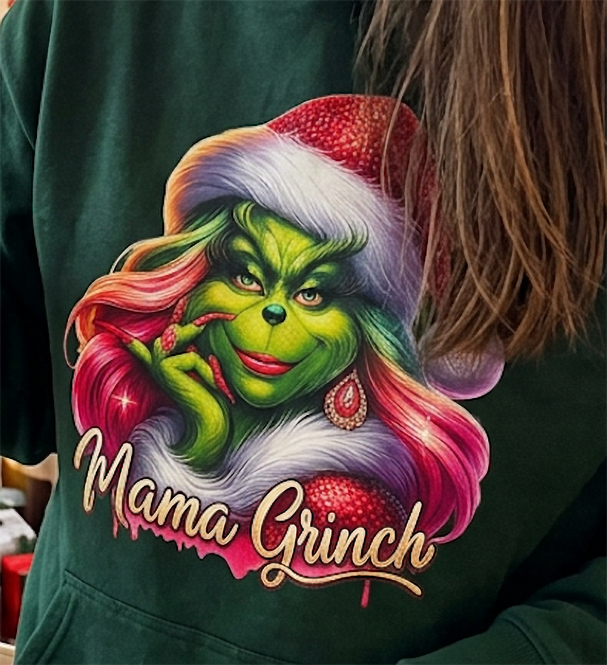 Close-up of Mama Grinch graphic on forest green Christmas hoodie