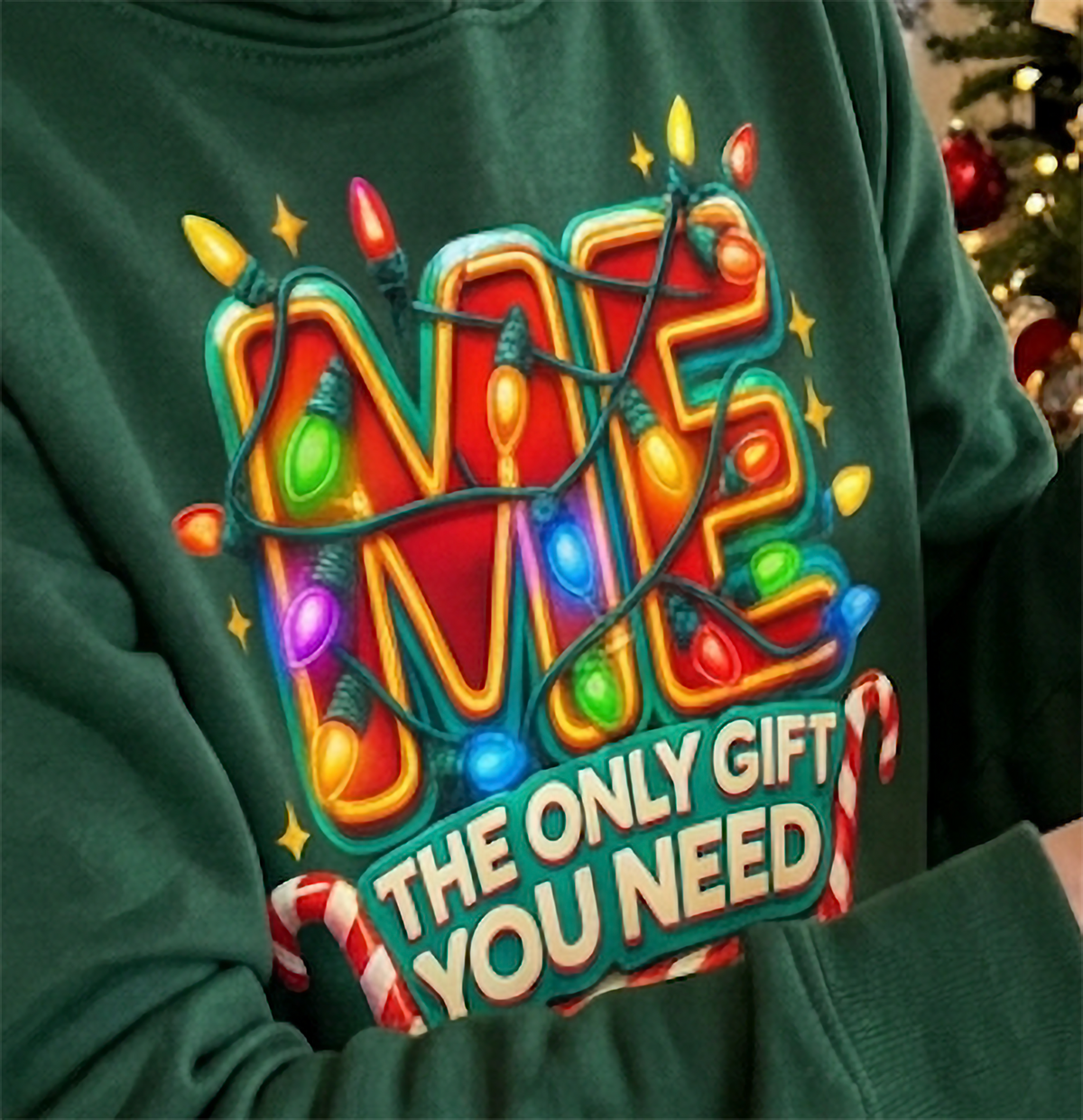 Close-up of Me The Only Gift You Need graphic on forest green Christmas hoodie