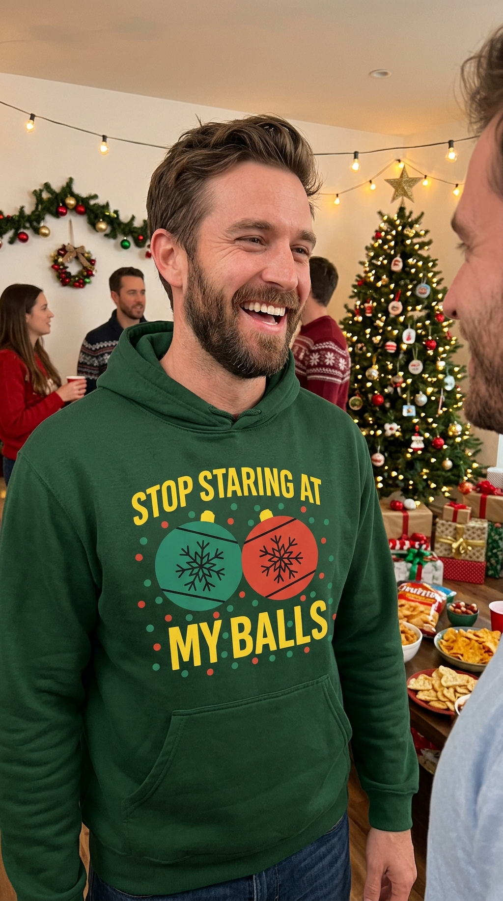 Man wearing forest green Stop Staring at My Balls funny Christmas hoodie at a holiday gathering