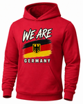 A red pullover hoodie featuring a graphic print of the German flag and the German coat of arms, with the text 'WE ARE' above and 'GERMANY' below, shown on a plain white background.