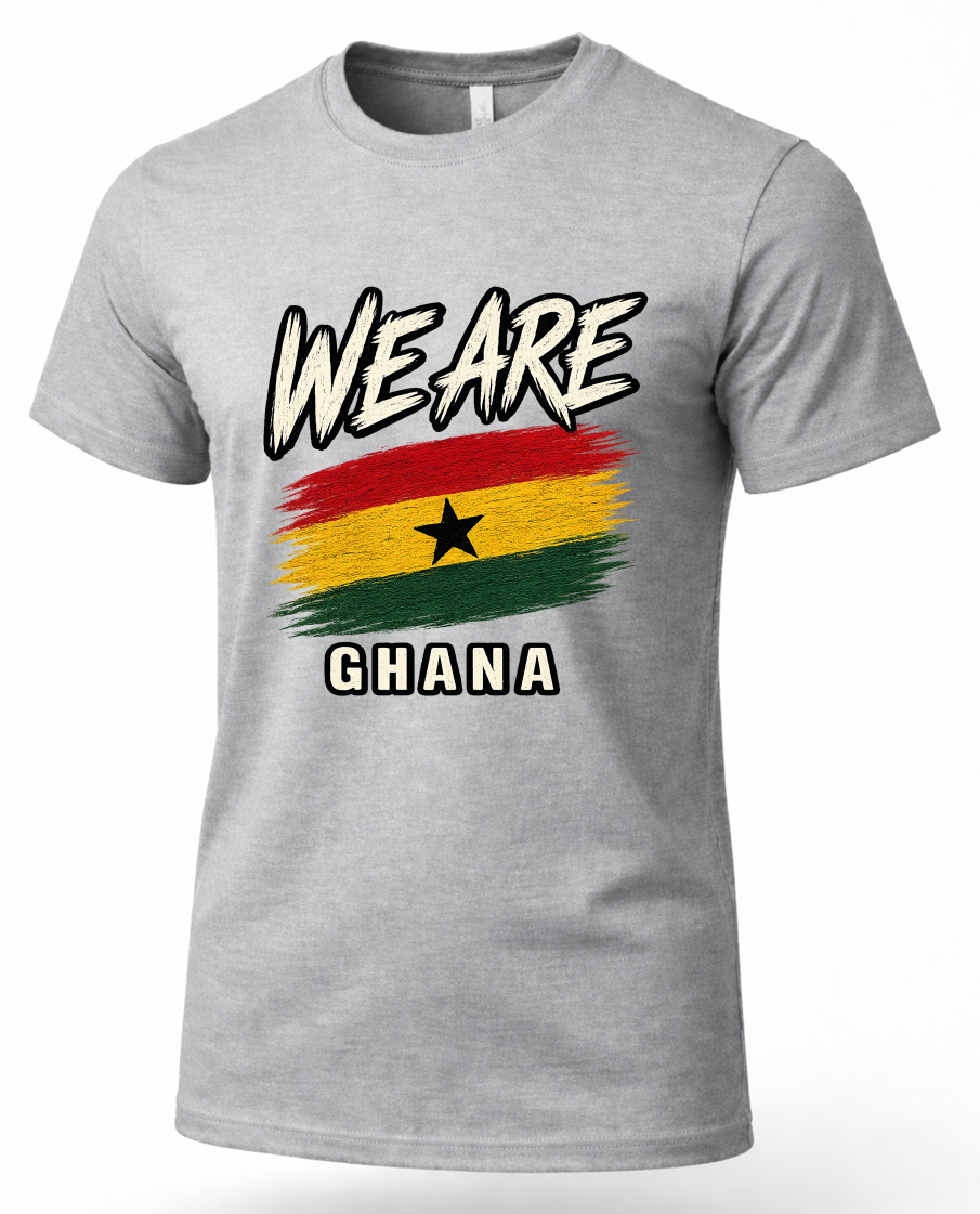 A heather gray short-sleeve t-shirt featuring a distressed graphic of the Ghana flag with the text 'WE ARE' above and 'GHANA' below, displayed on a clean white background.