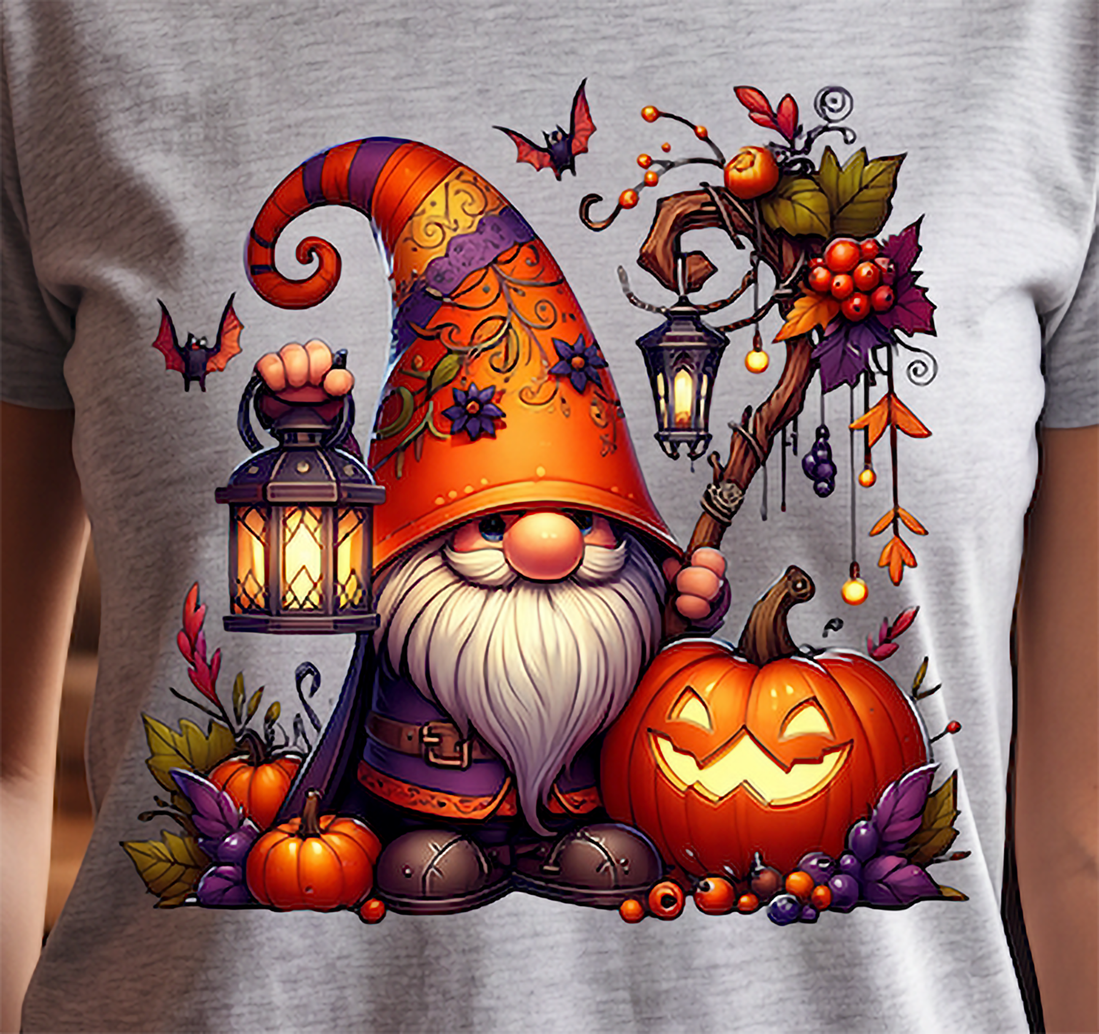 Close-up of Halloween gnome graphic with colorful hat, glowing pumpkin, lantern, bats and fall foliage