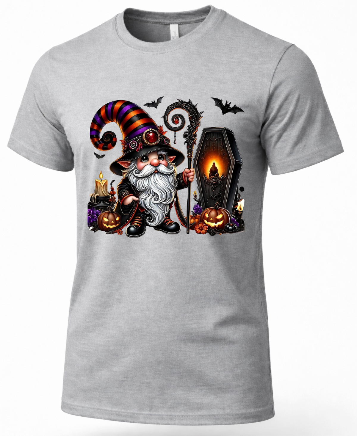 A heather gray short-sleeve crewneck t-shirt featuring a colorful graphic print of a cute cat dressed as a wizard, holding a staff next to a coffin, with pumpkins, bats, and candles.