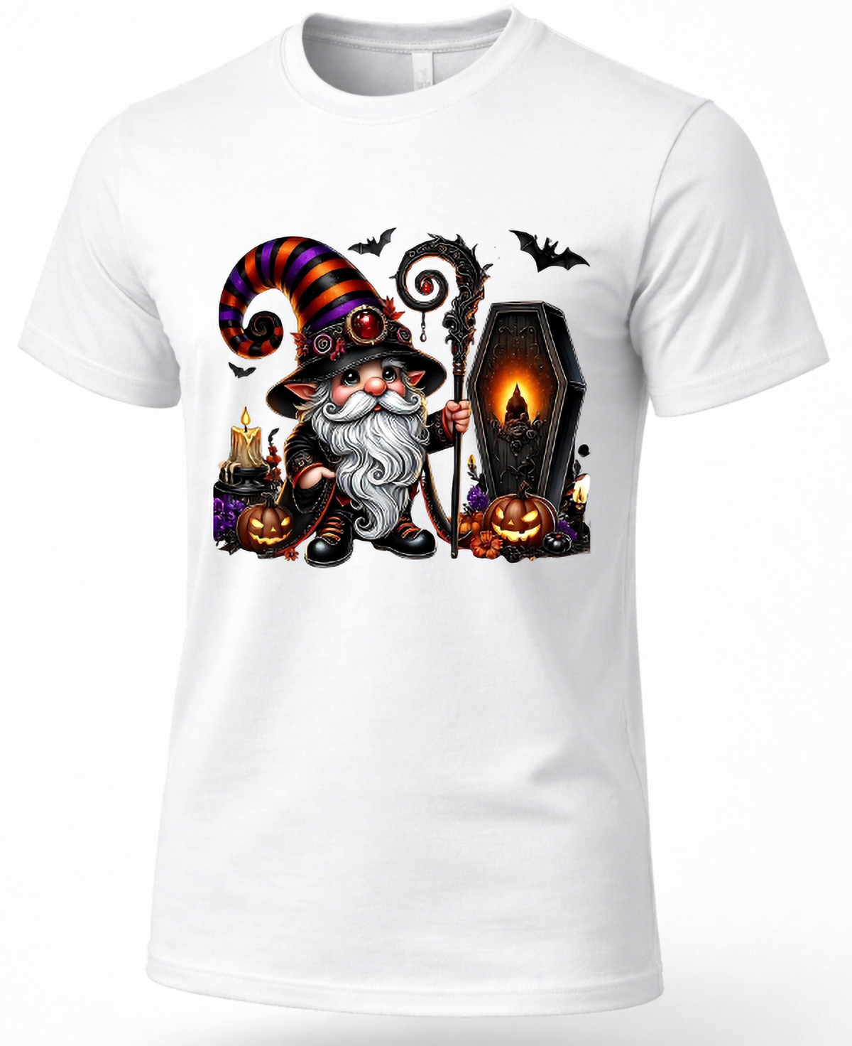 A white short-sleeve crewneck t-shirt featuring a colorful graphic print of a cartoon witch gnome holding a staff next to a glowing coffin, with pumpkins, bats, and candles.
