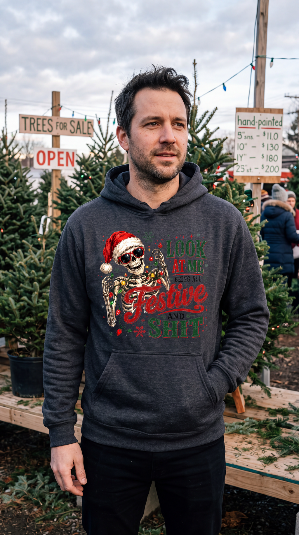 Man wearing gray Christmas skeleton hoodie with funny festive skull design
