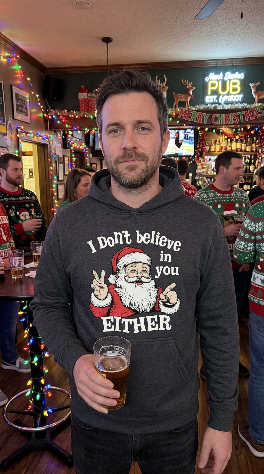 Man wearing gray I Don’t Believe in You Either Santa hoodie at a holiday gathering