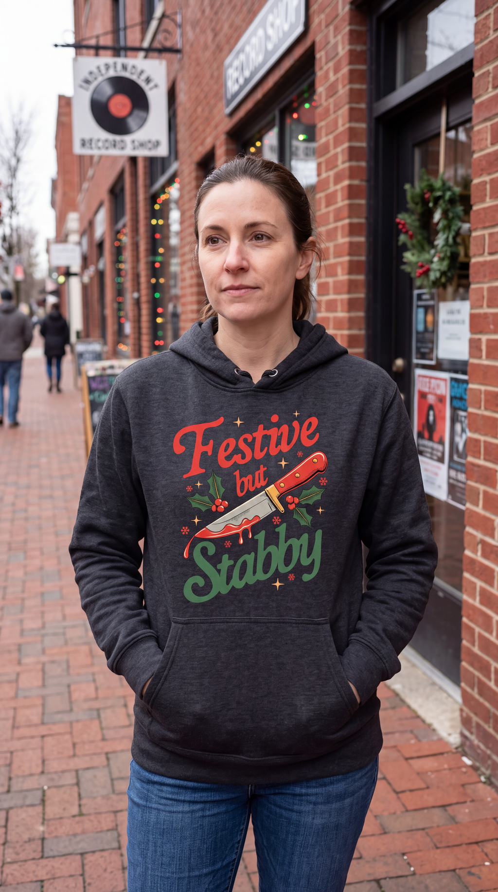 Woman wearing gray Festive But Stabby sarcastic Christmas hoodie