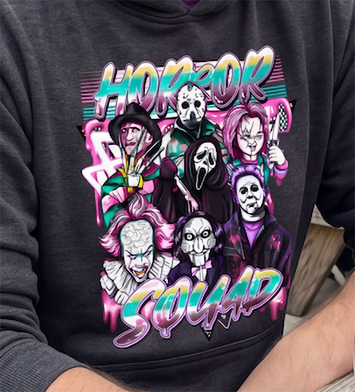 Close-up of dark gray Horror Squad Halloween hoodie with retro horror graphic