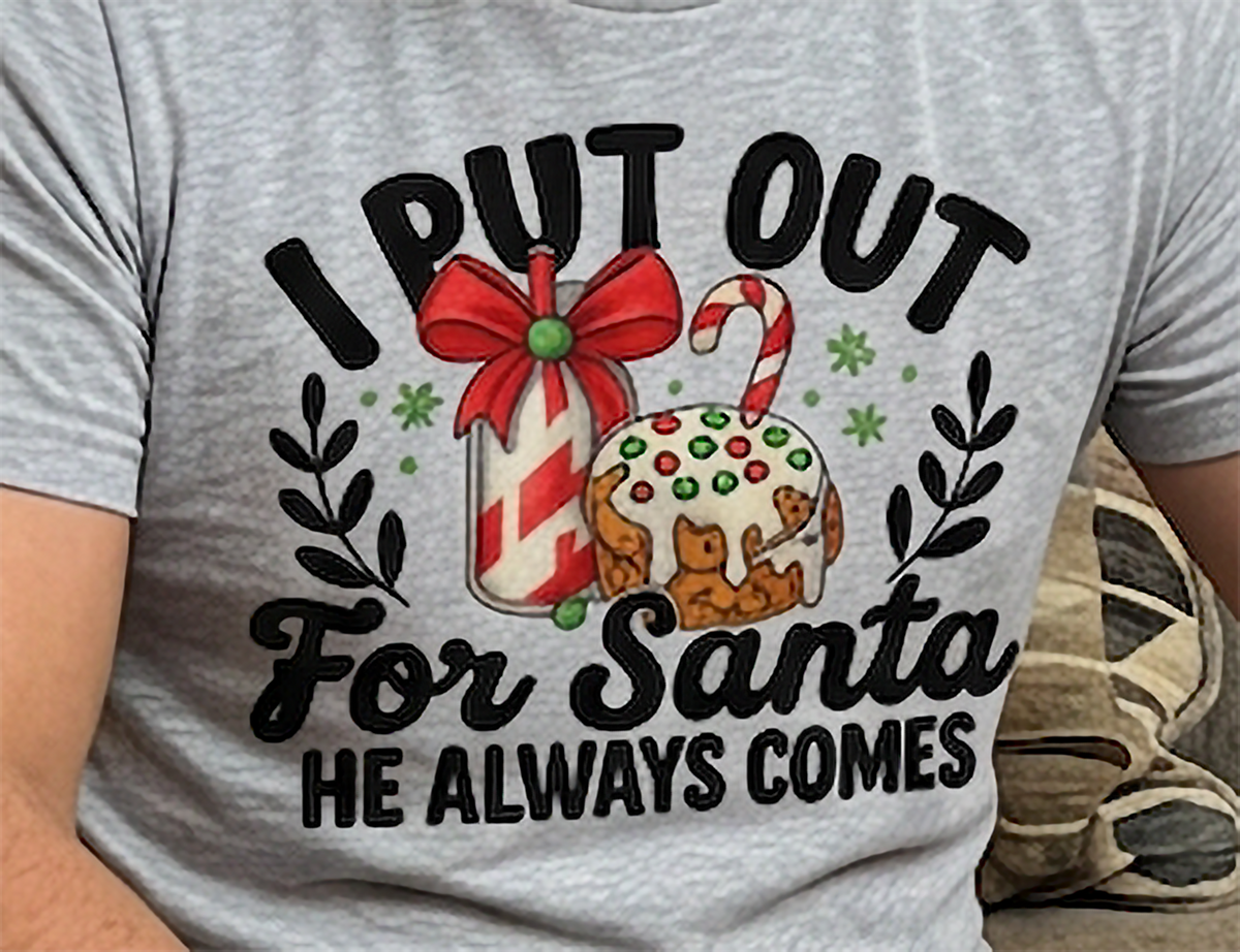 Close-up of I Put Out for Santa He Always Comes graphic on heather gray shirt