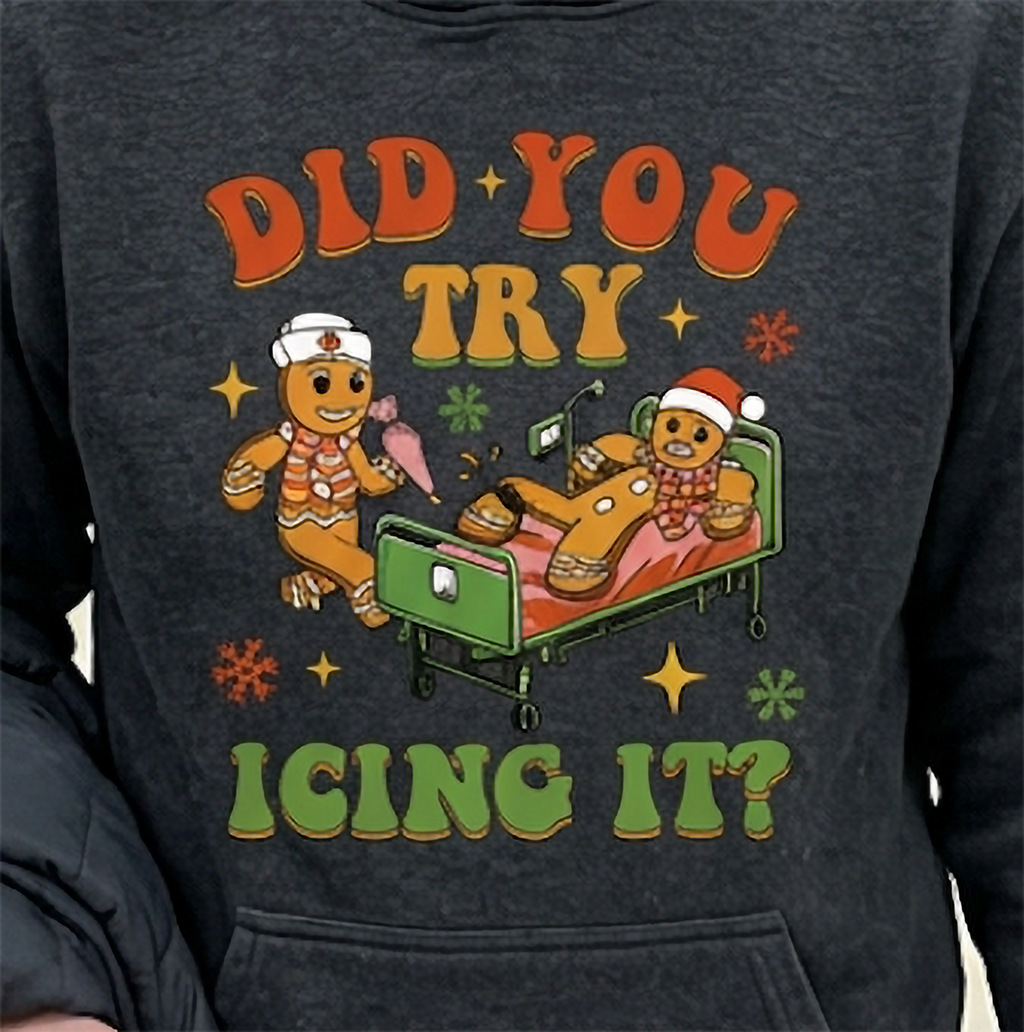 Close-up of Did You Try Icing It gingerbread graphic on gray Christmas hoodie