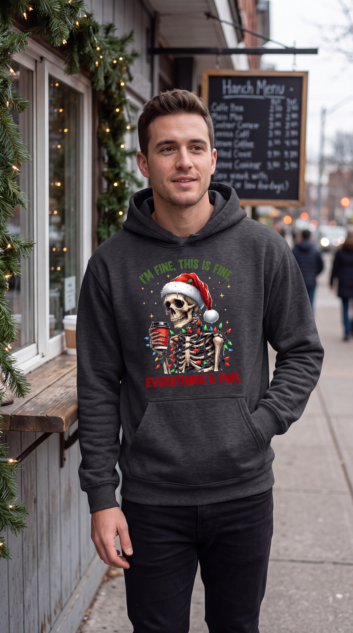 Man wearing gray Christmas skeleton hoodie with I’m Fine Everything’s Fine design