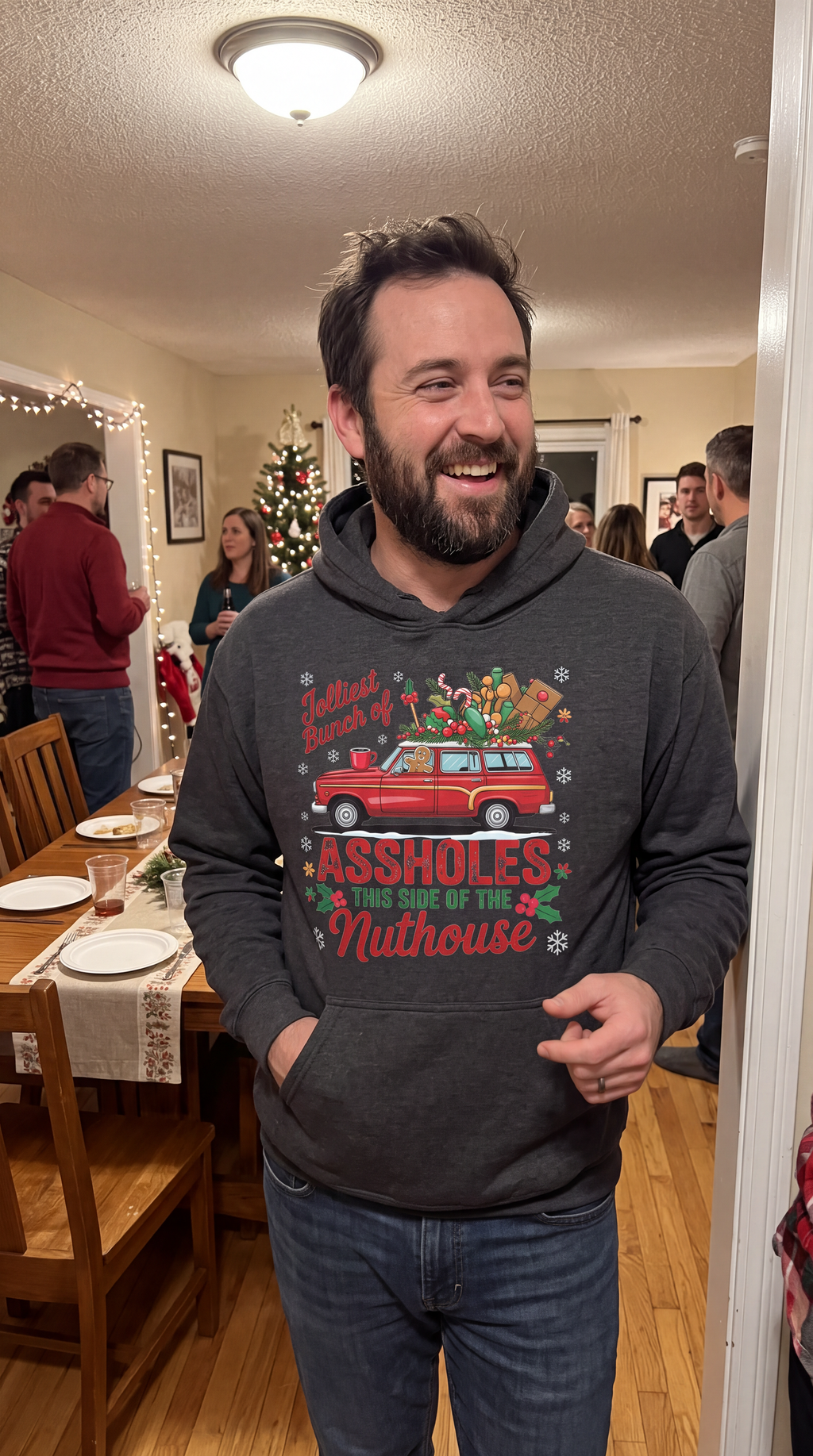 Man wearing gray Jolliest Bunch funny family Christmas hoodie