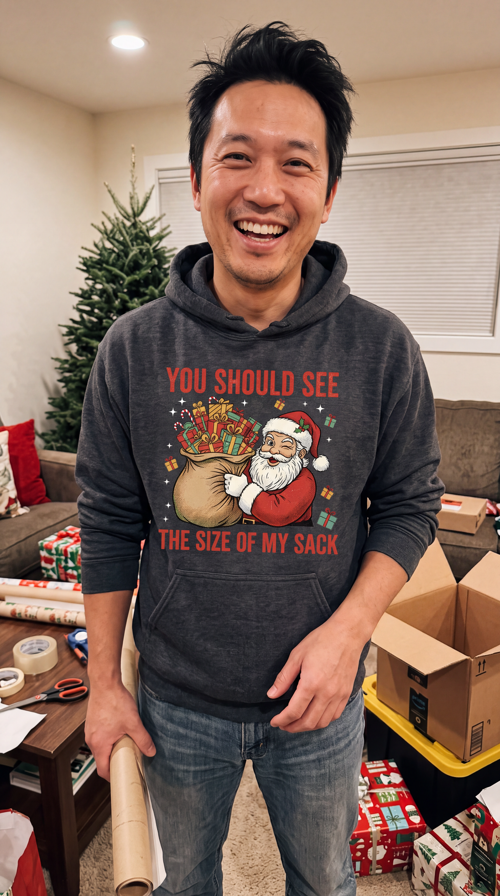 Man wearing gray funny Santa Christmas hoodie with Size of My Sack holiday design