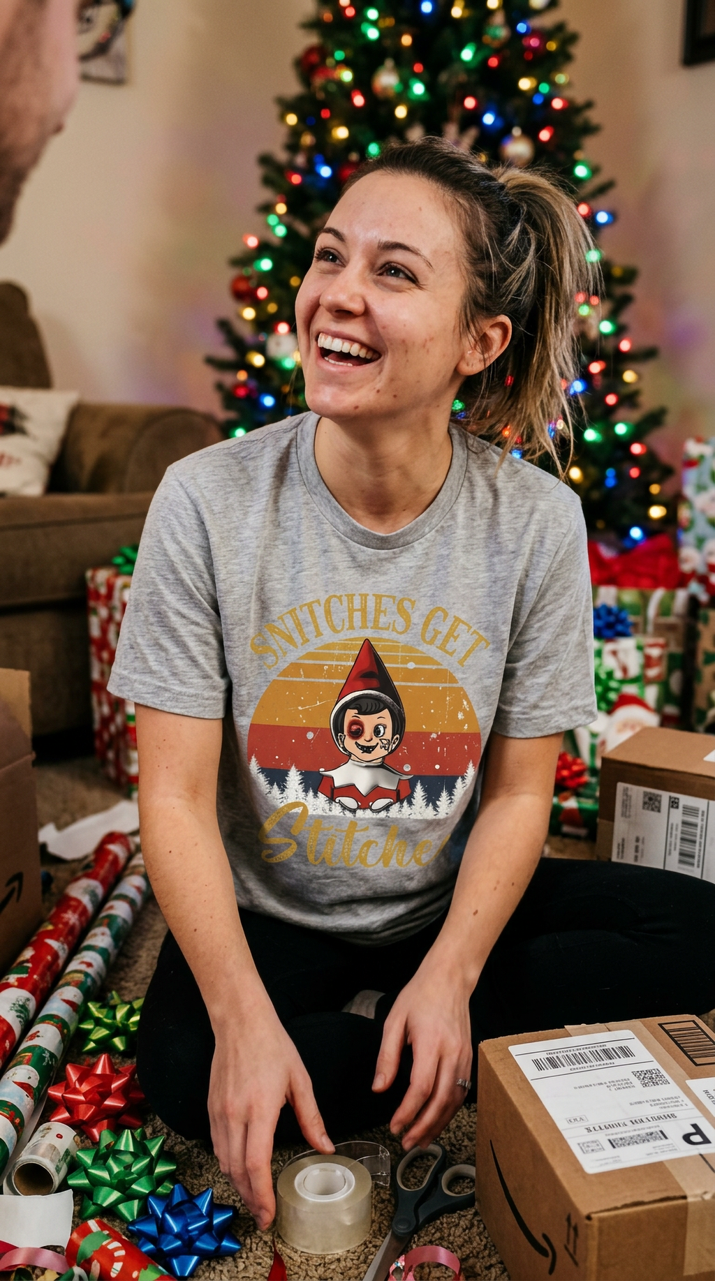Smiling woman wearing a heather gray retro Christmas elf shirt at a festive holiday gathering.